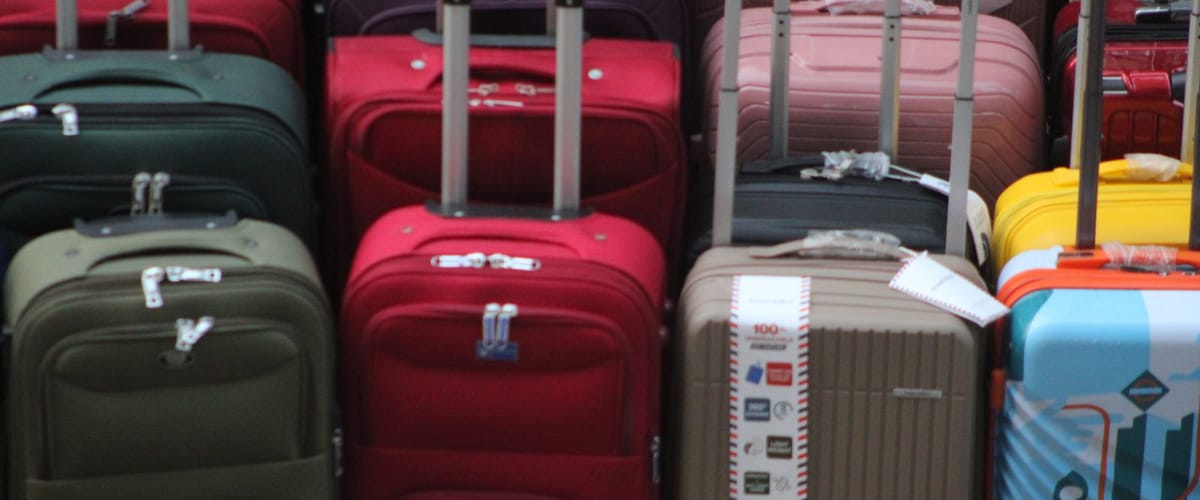 Luggage suitcases lined up at an airport