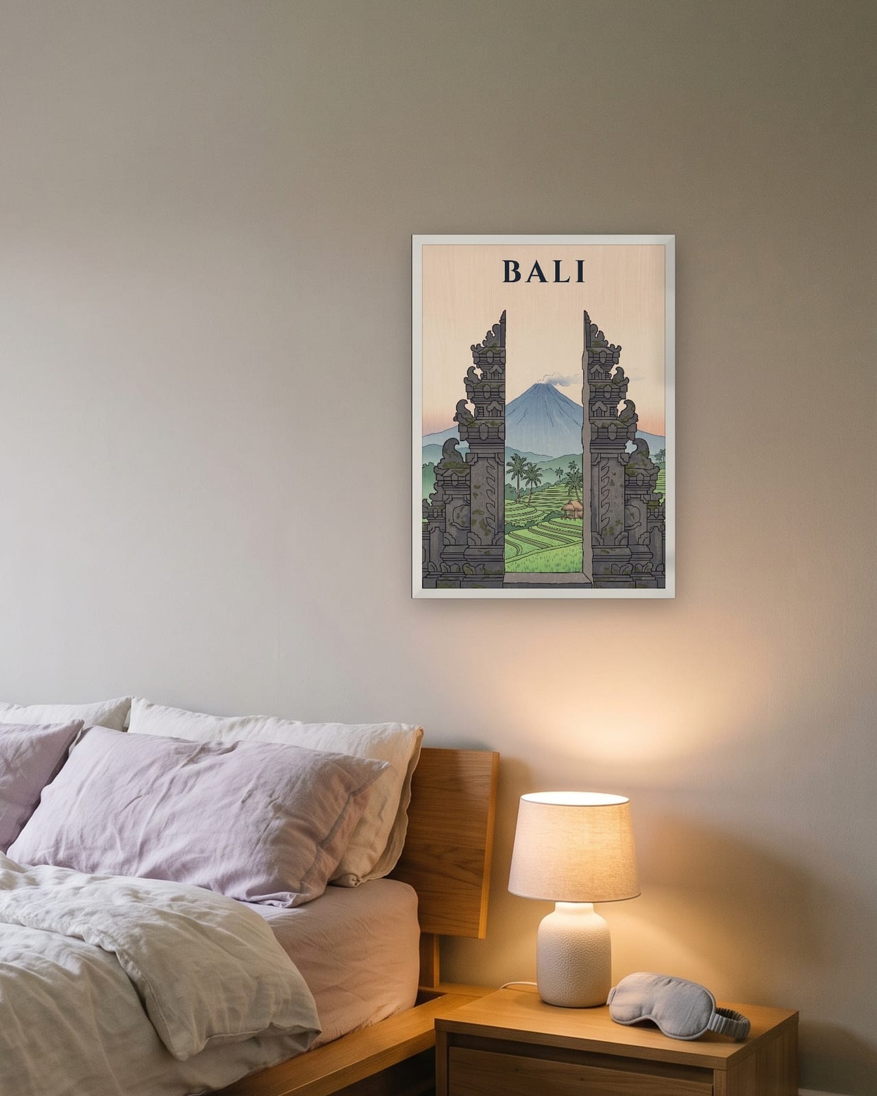 Bali Temple Gate print, white frame A3 above a bedside table