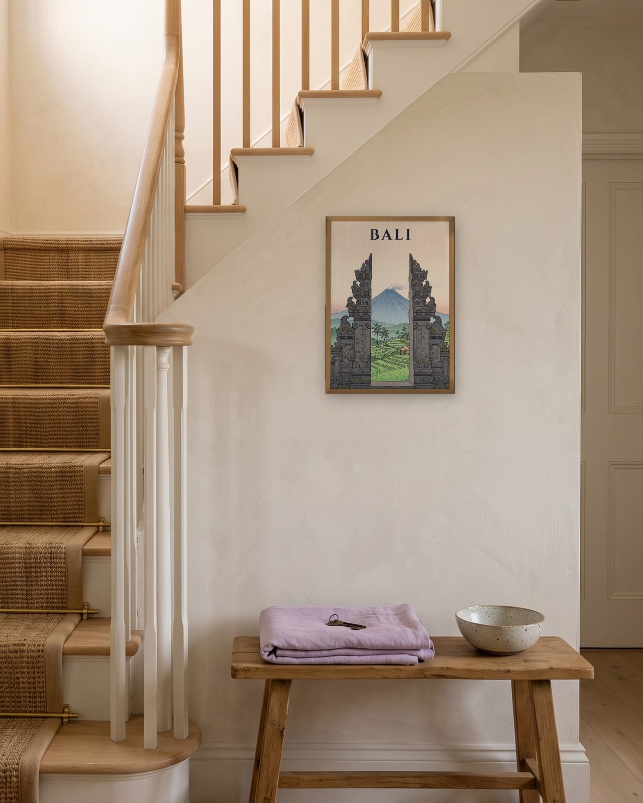 Bali Temple Gate print, natural oak frame A3 on a staircase wall