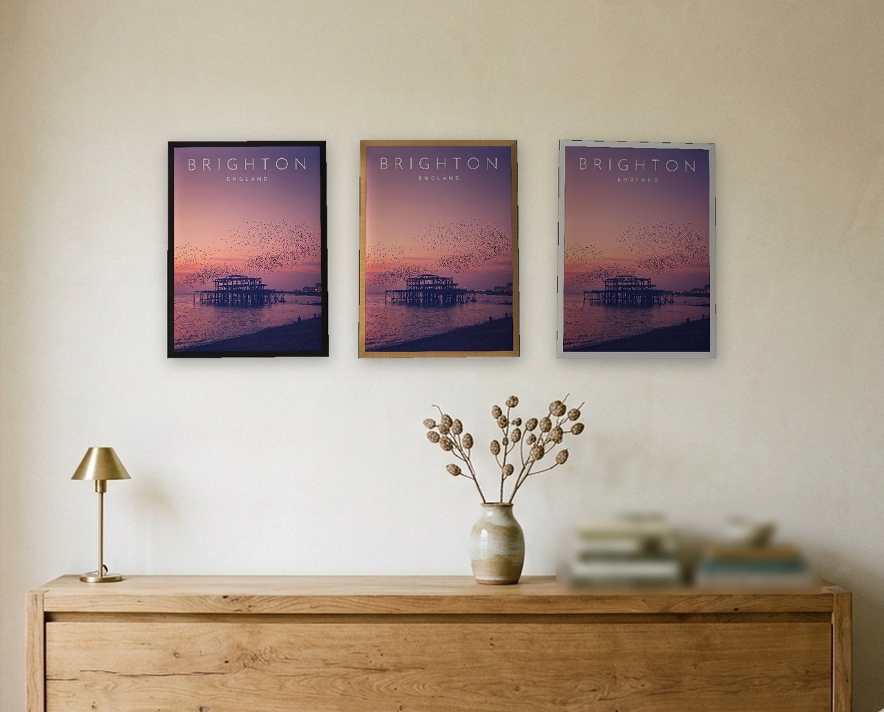 Brighton West Pier at Sunset print: the three frame finishes side by side black, natural oak and white