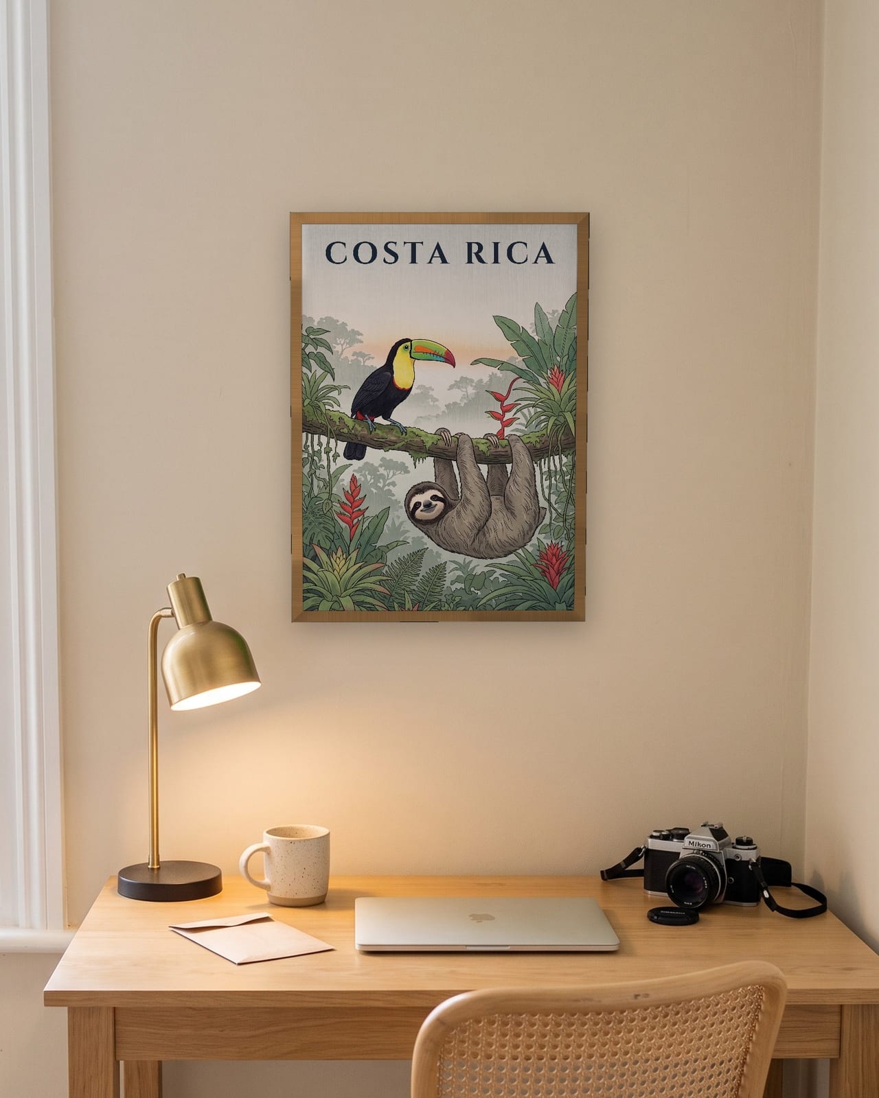 Costa Rica Toucan and Sloth print, natural oak frame A3 above a home office desk