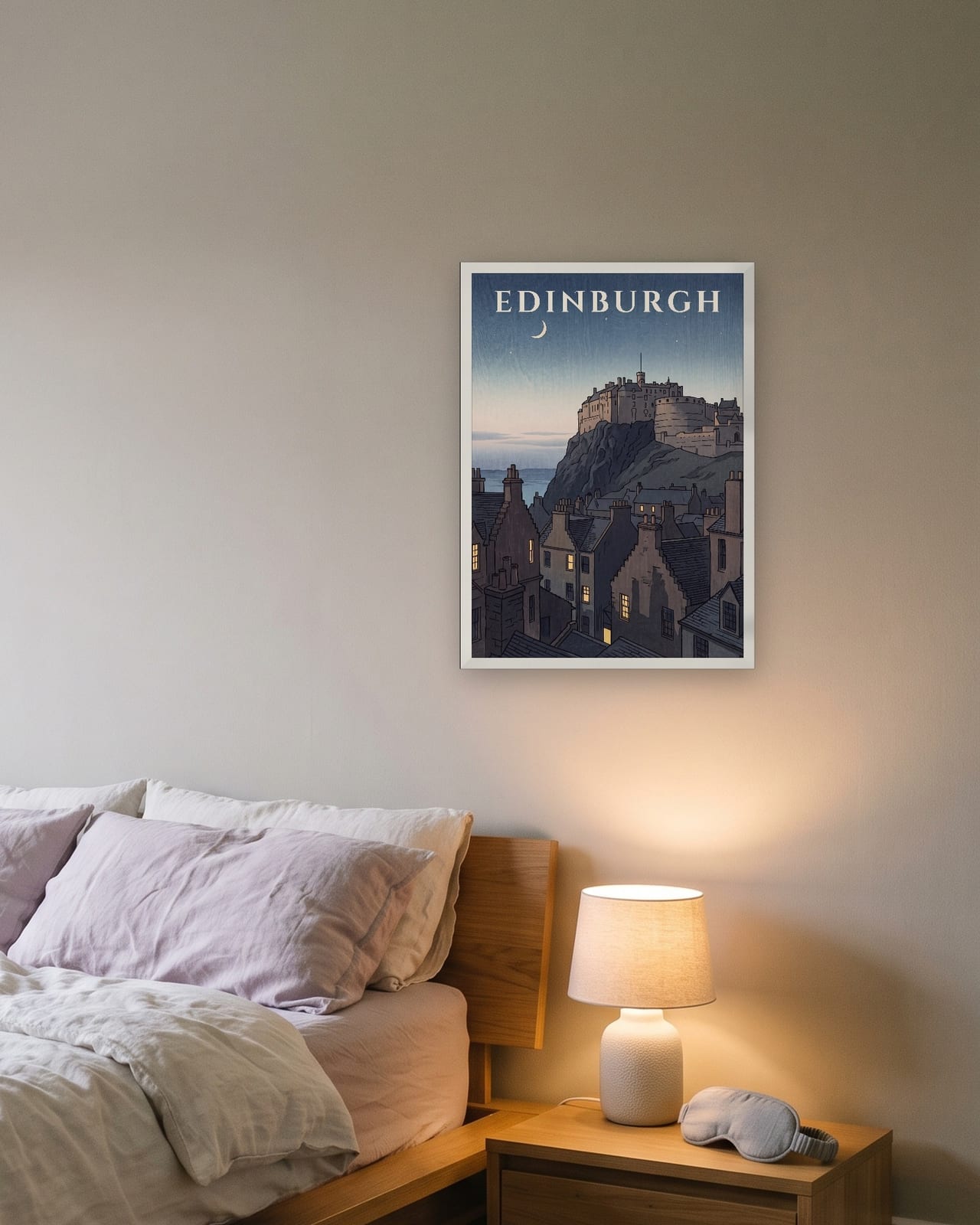 Edinburgh Castle at Dusk print, white frame A3 above a bedside table