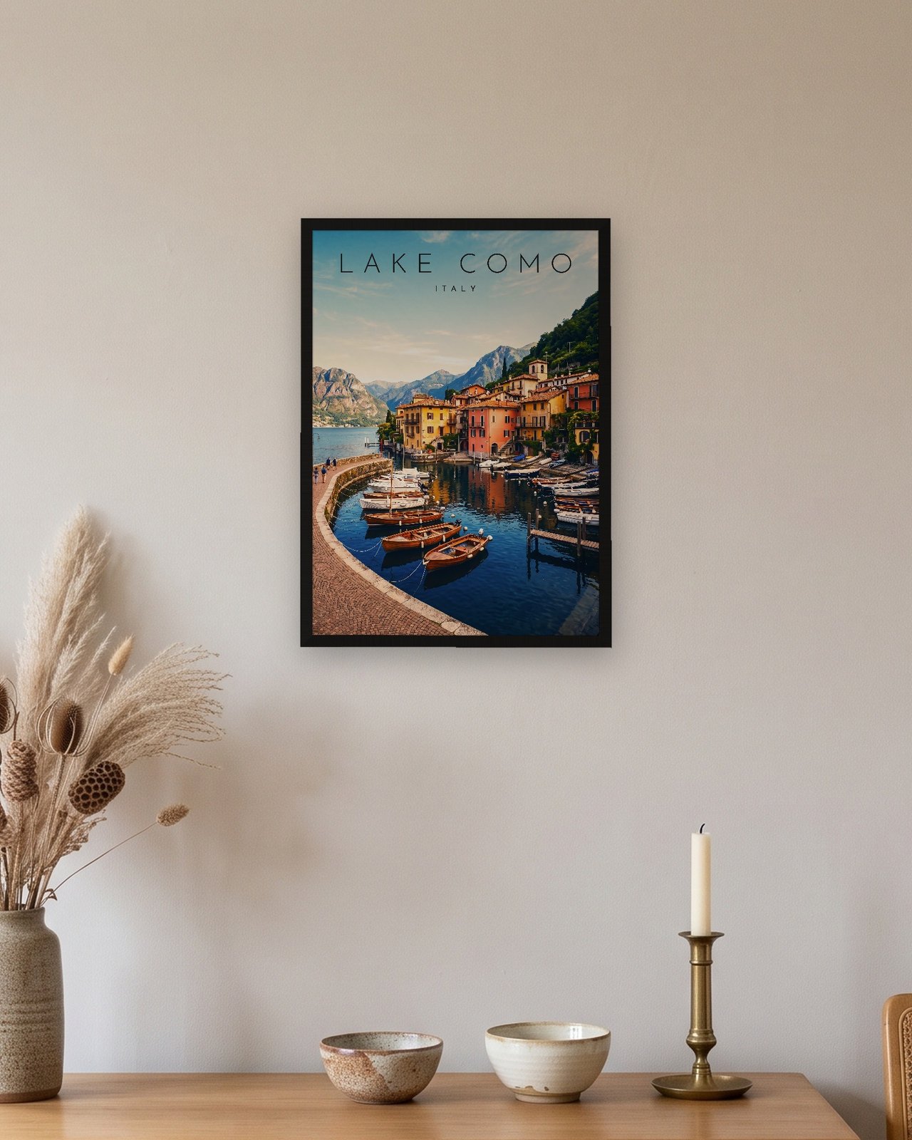 Lake Como, Varenna Harbour print, black frame A3 above an oak sideboard
