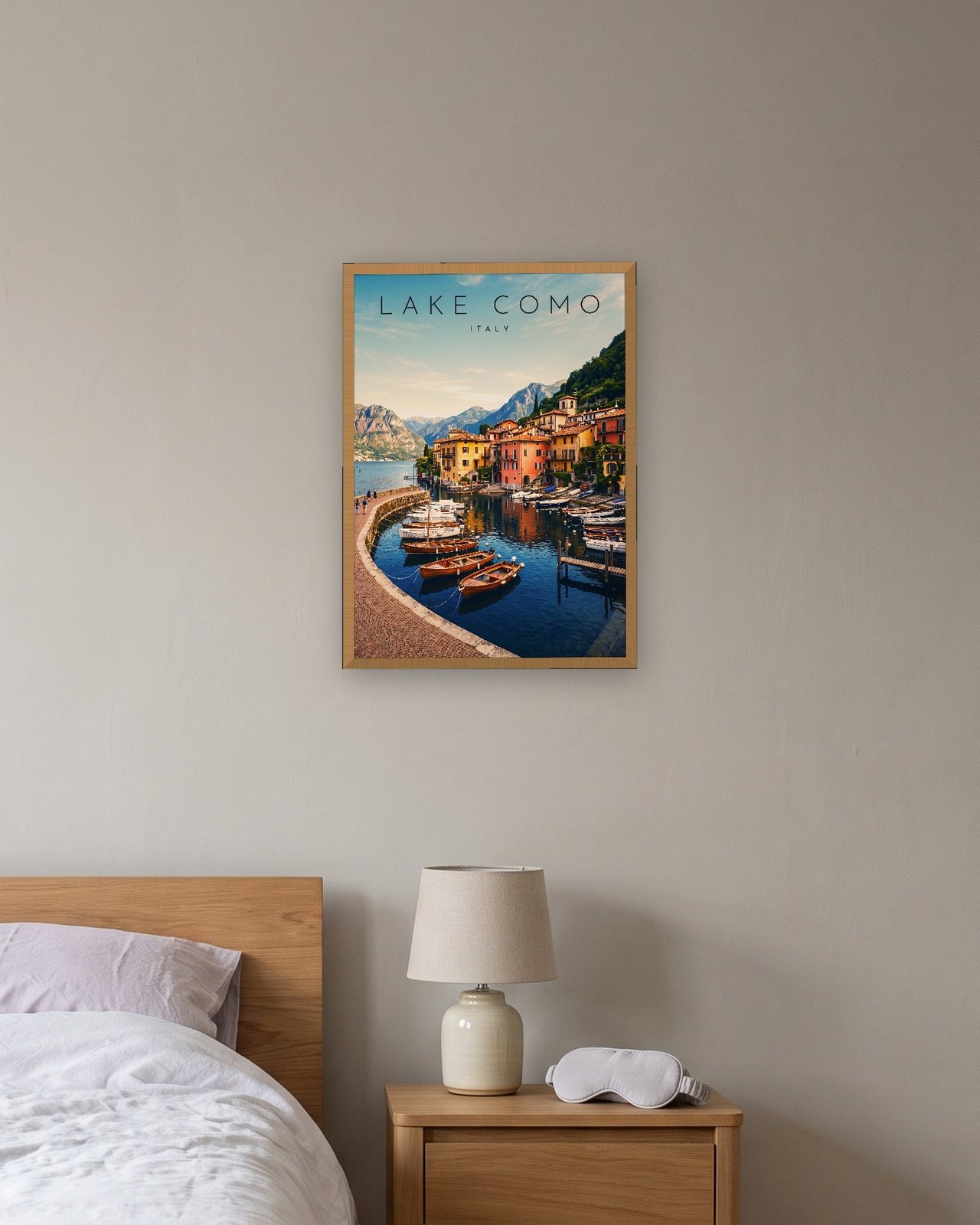 Lake Como, Varenna Harbour print, natural oak frame A3 above a bedside table