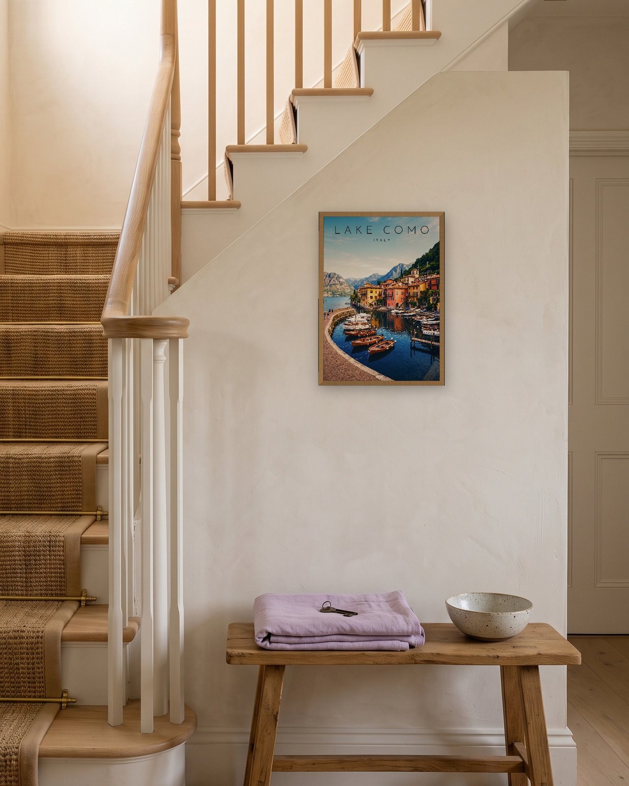 Lake Como, Varenna Harbour print, natural oak frame A3 on a staircase wall