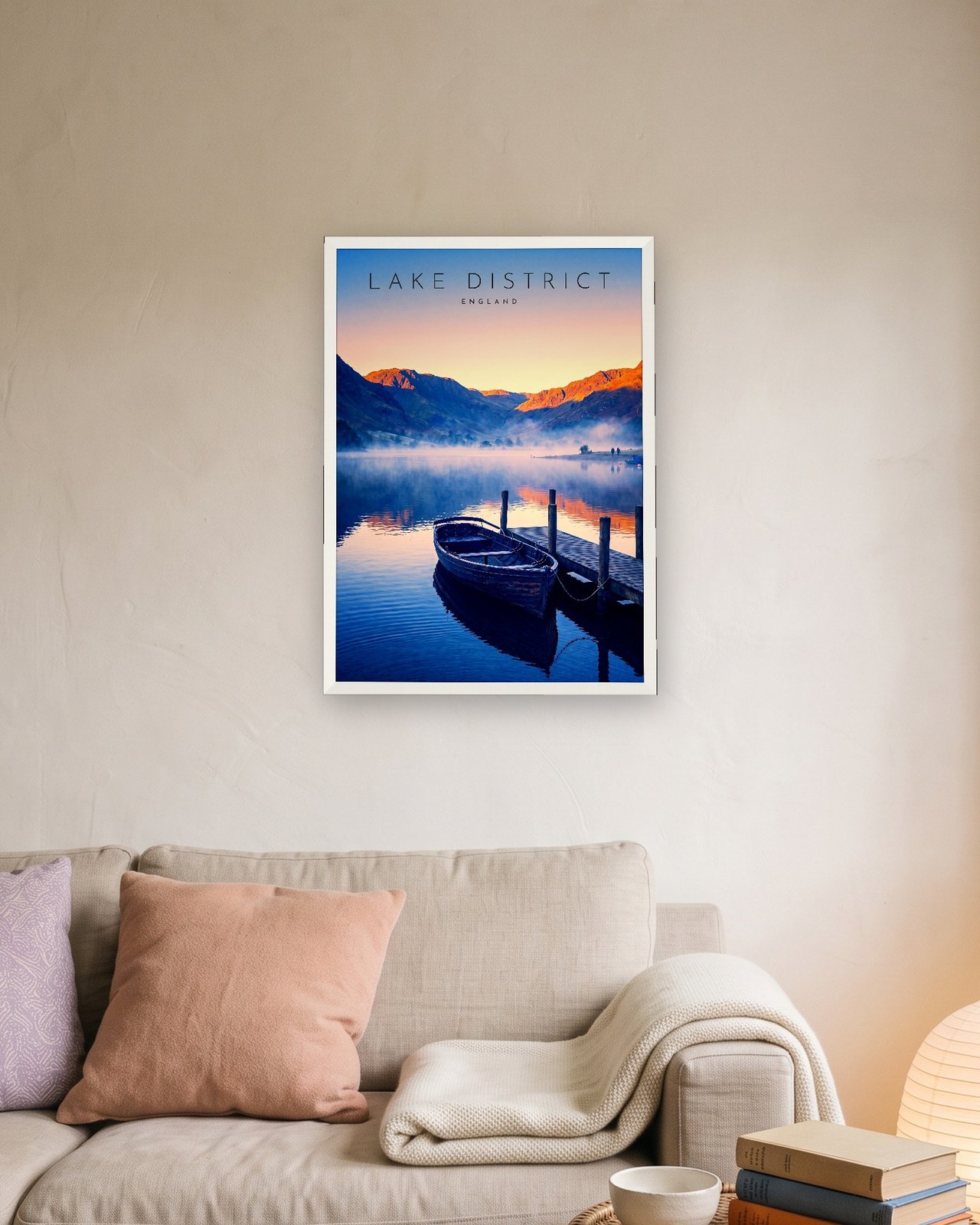 Derwentwater at Dawn print, white frame A3 above a linen sofa