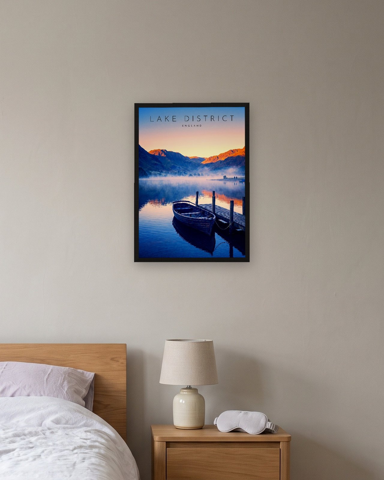 Derwentwater at Dawn print, black frame A3 above a bedside table