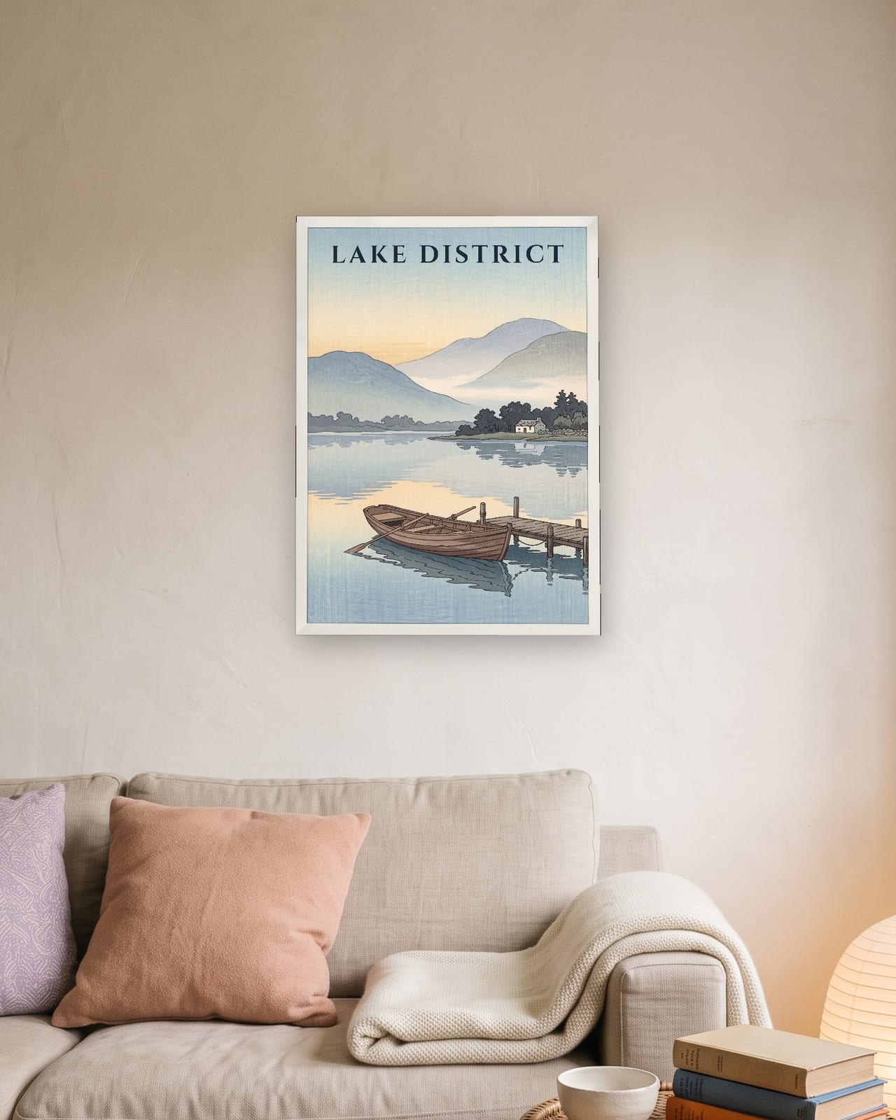 Lake District Rowing Boat print, white frame A3 above a linen sofa