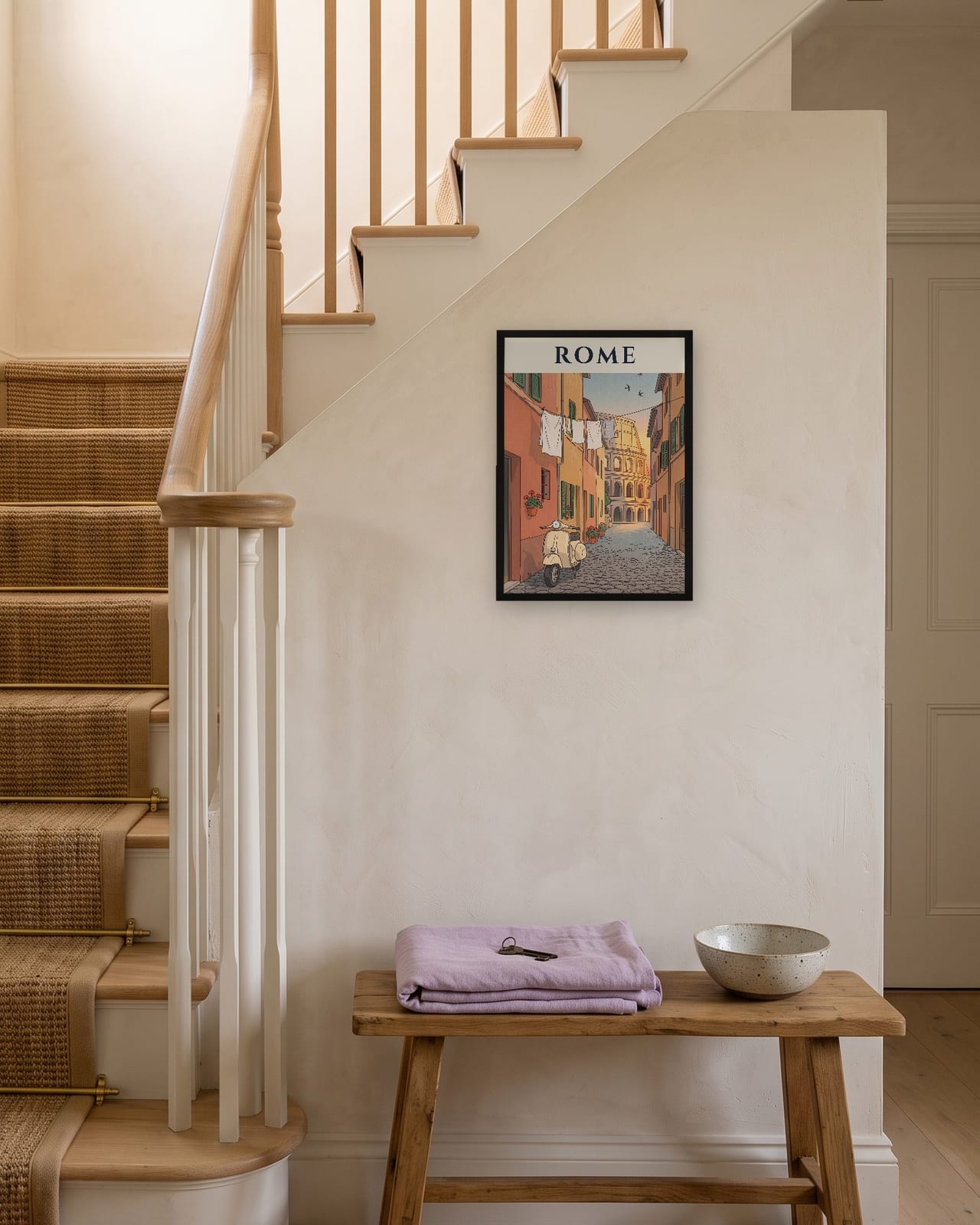 Rome Scooter and Colosseum print, black frame A3 on a staircase wall