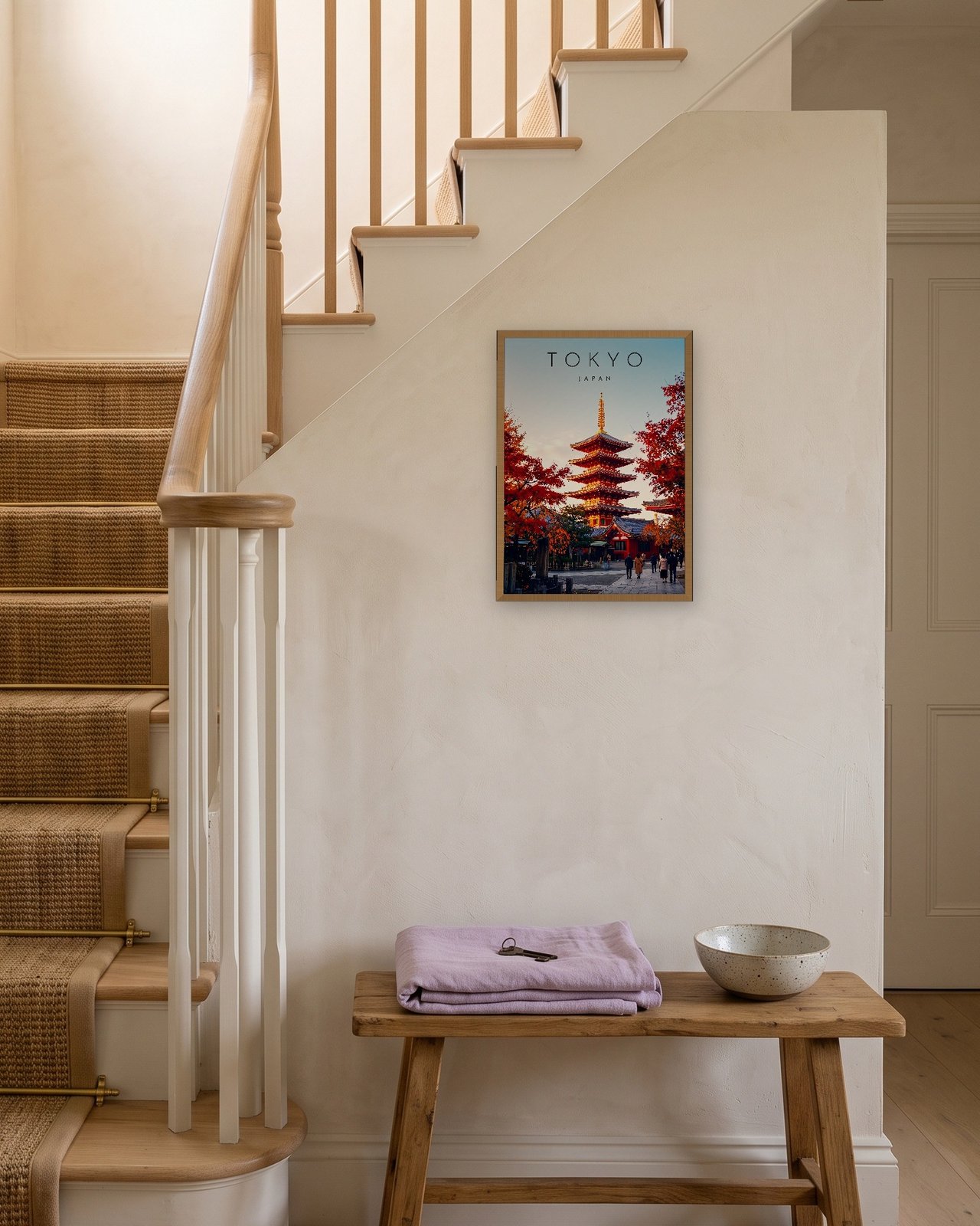 Tokyo Pagoda in Autumn print, natural oak frame A3 on a staircase wall