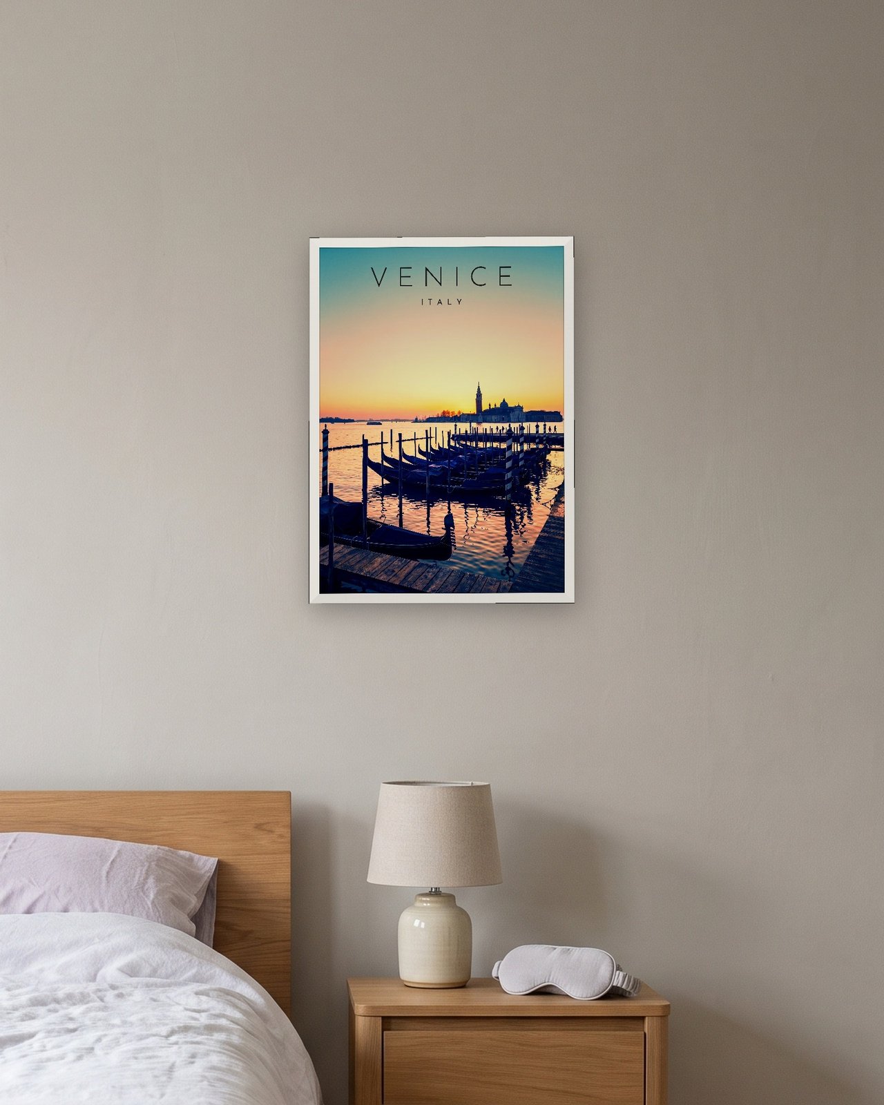 Venice Gondolas at Sunrise print, white frame A3 above a bedside table