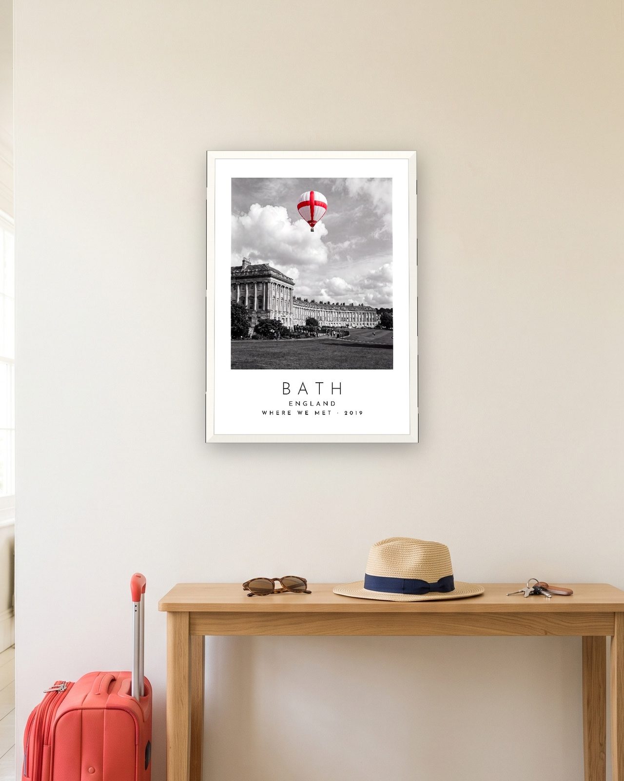 Our Trip Bath print: white frame A3 in a hallway with a packed suitcase, personalised WHERE WE MET · 2019