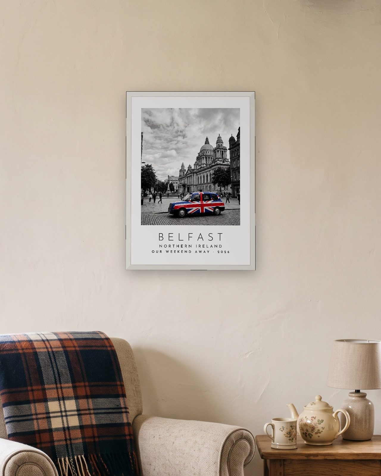 Our Trip Belfast print: white frame A3 in a cottage snug, personalised OUR WEEKEND AWAY · 2026