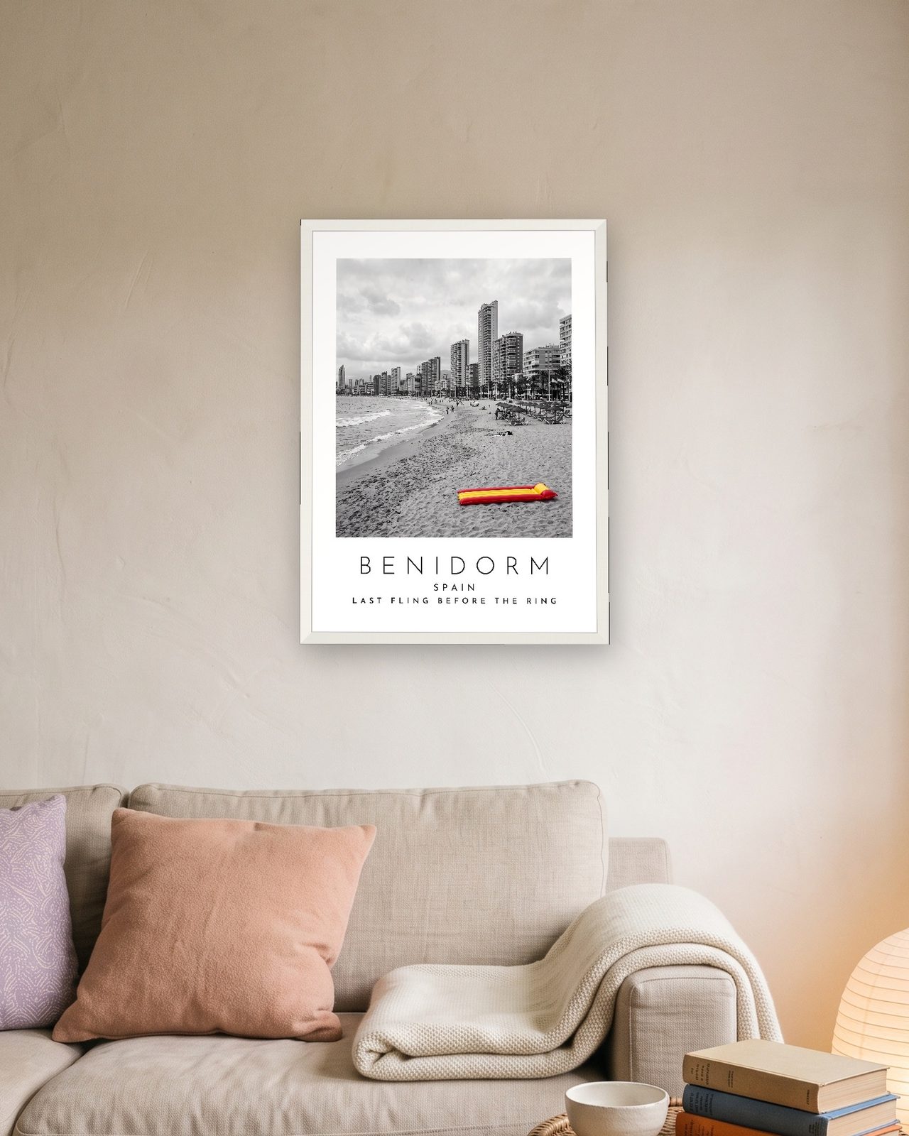 Our Trip Benidorm print: white frame A3 above a linen sofa, personalised LAST FLING BEFORE THE RING