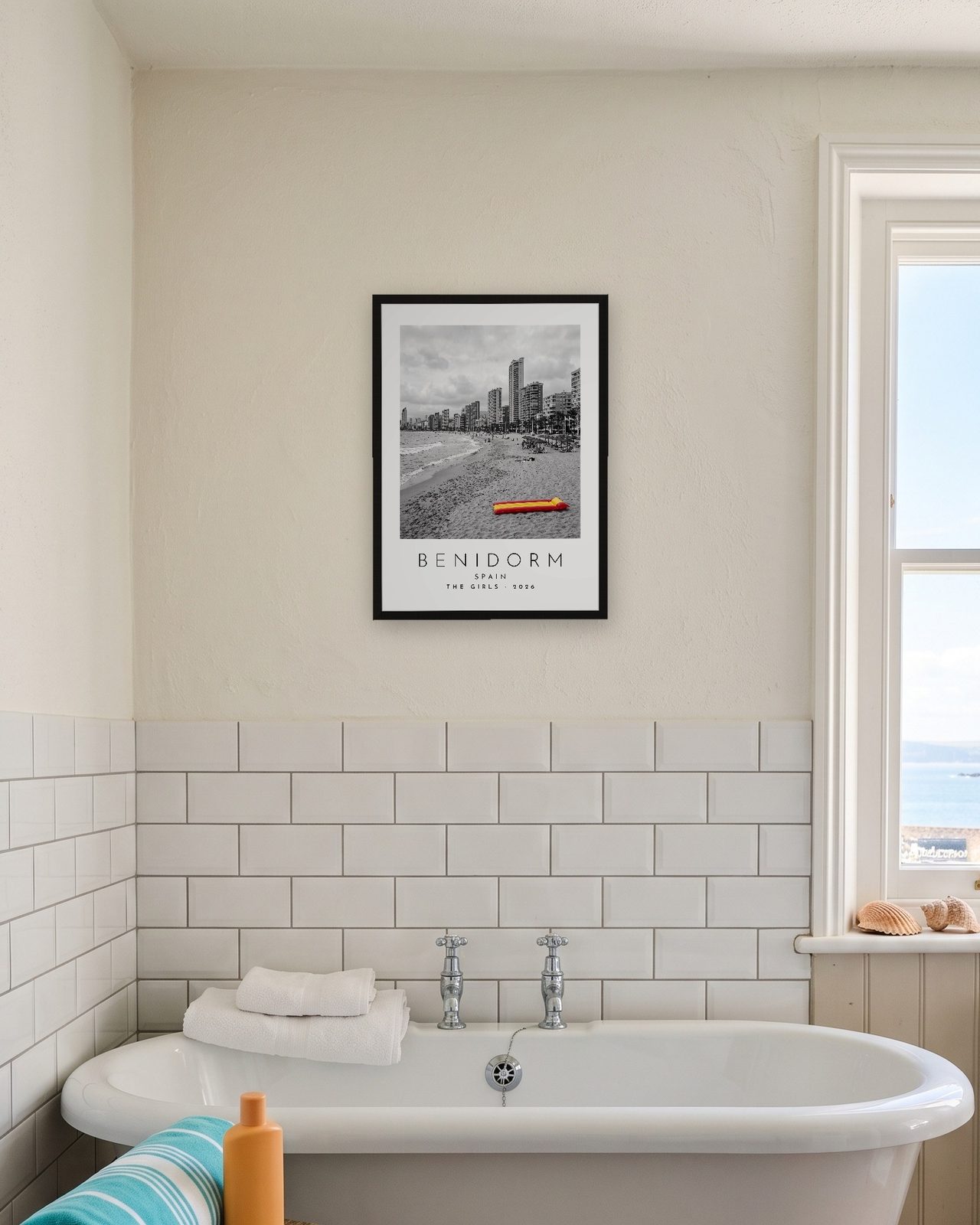 Our Trip Benidorm print: black frame A3 in a seaside bathroom, personalised THE GIRLS · 2026