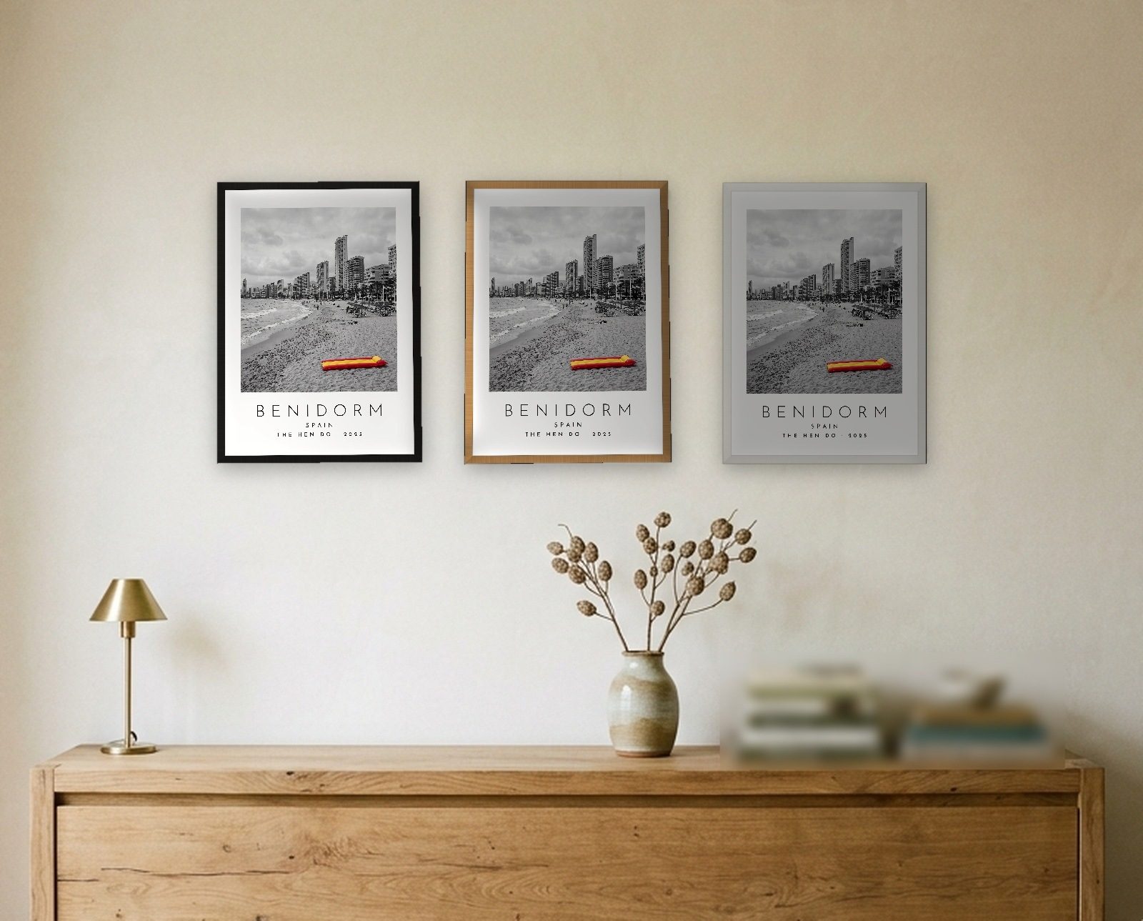 Our Trip Benidorm print: the three frame finishes side by side black natural oak white