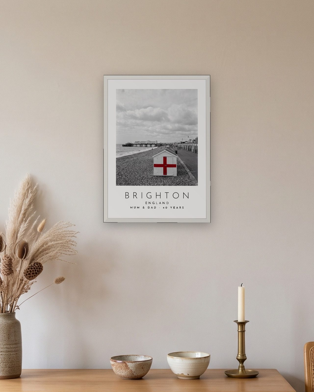 Our Trip Brighton print: white frame A3 above an oak sideboard, personalised MUM & DAD · 40 YEARS
