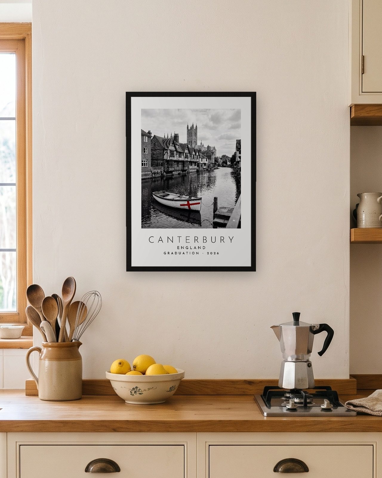 Our Trip Canterbury print: black frame A3 in a bright kitchen, personalised GRADUATION · 2026