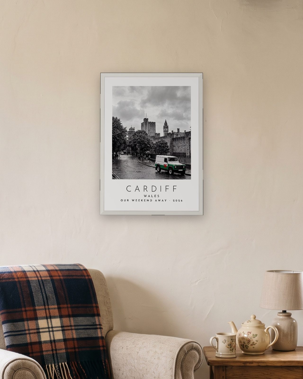 Our Trip Cardiff print: white frame A3 in a cottage snug, personalised OUR WEEKEND AWAY · 2026