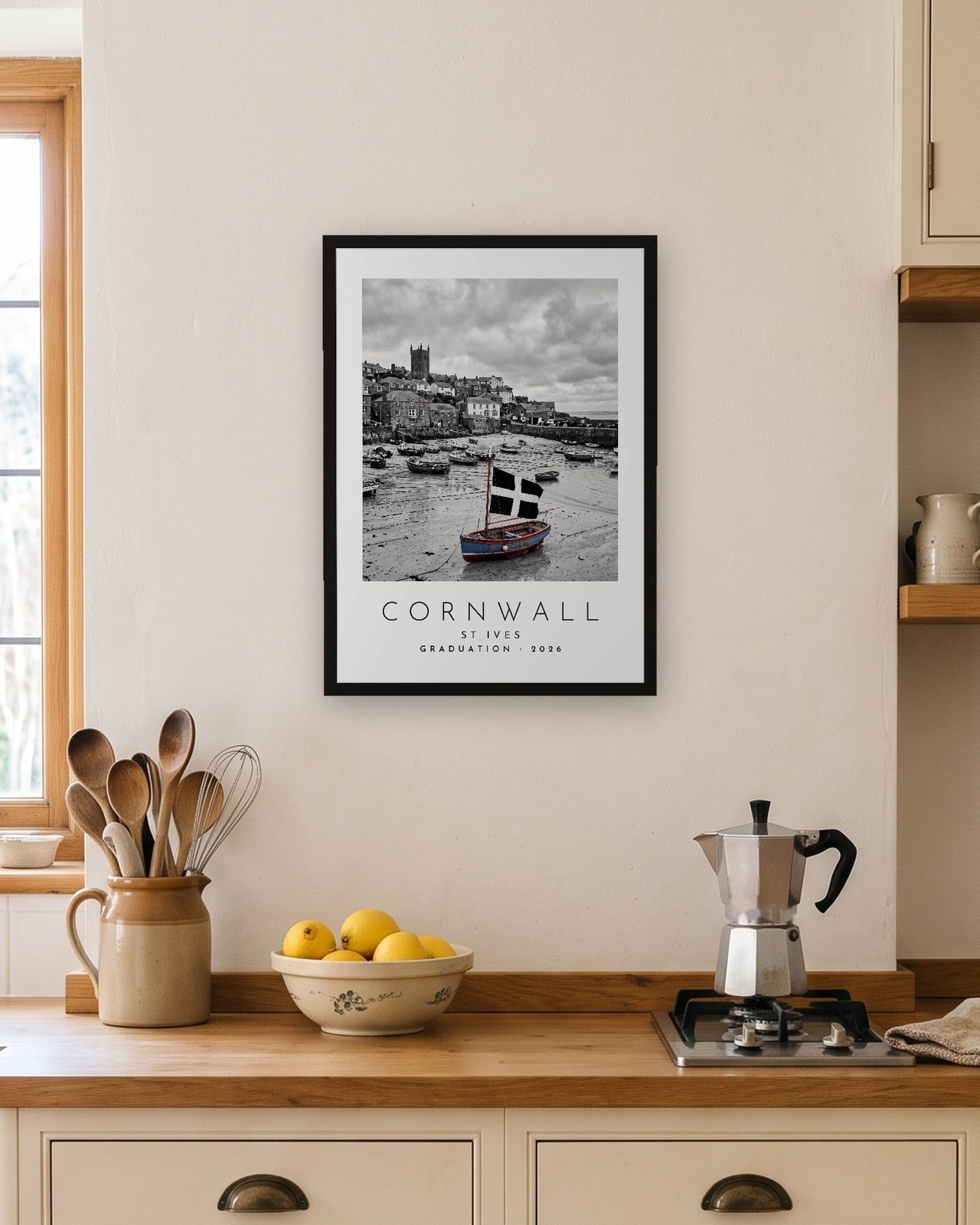 Our Trip Cornwall, St Ives print: black frame A3 in a bright kitchen, personalised GRADUATION · 2026