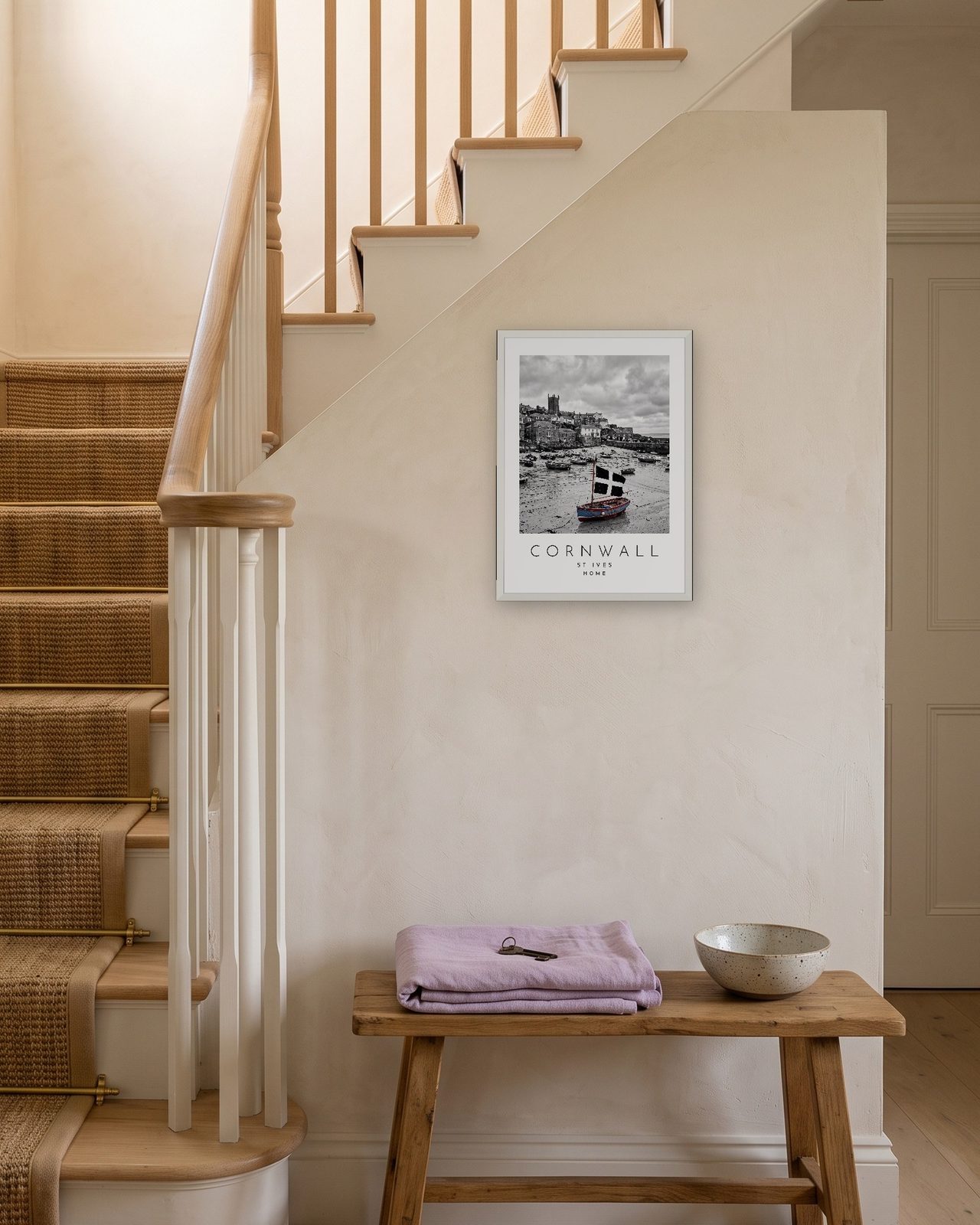 Our Trip Cornwall, St Ives print: white frame A3 on a staircase wall, personalised HOME