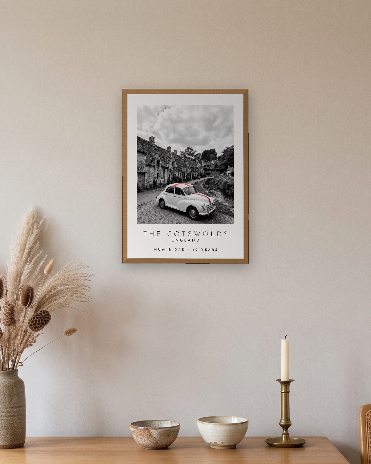 Our Trip The Cotswolds print: natural oak frame A3 above an oak sideboard, personalised MUM & DAD · 40 YEARS