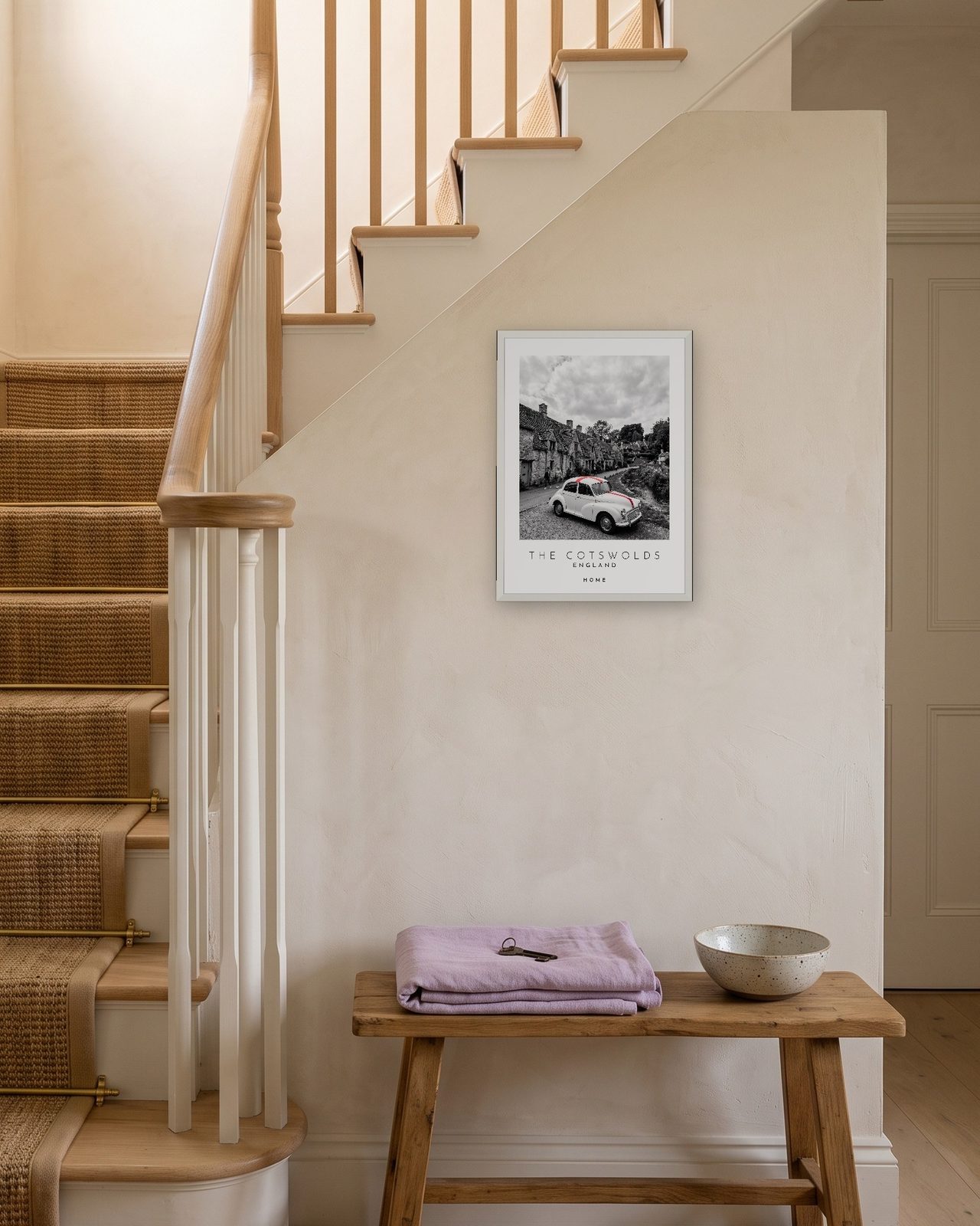 Our Trip The Cotswolds print: white frame A3 on a staircase wall, personalised HOME