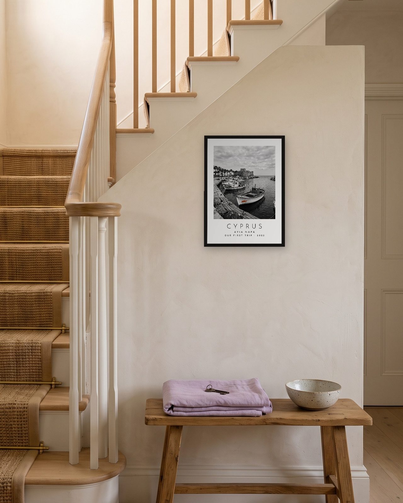 Our Trip Cyprus, Ayia Napa print: black frame A3 on a staircase wall, personalised OUR FIRST TRIP · 2023