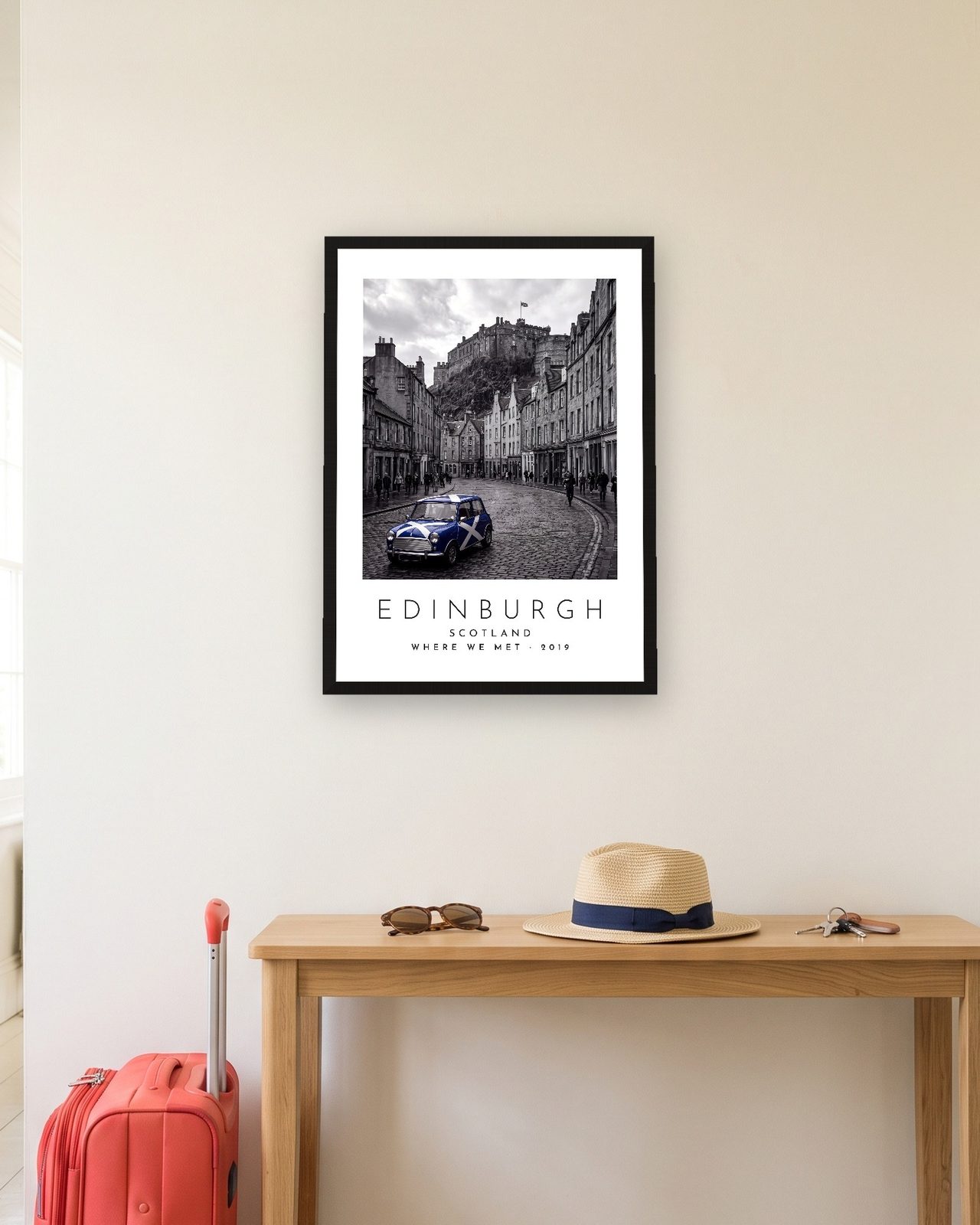 Our Trip Edinburgh print in a black frame in a hallway with a red suitcase, personalised WHERE WE MET · 2019