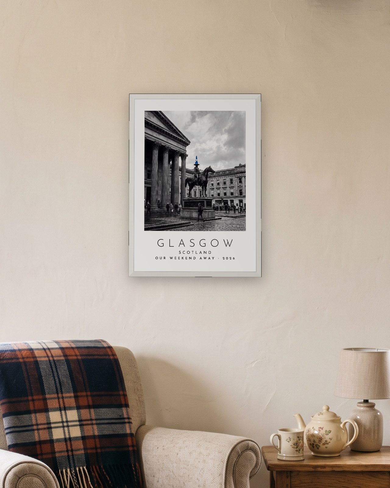 Our Trip Glasgow print: white frame A3 in a cottage snug, personalised OUR WEEKEND AWAY · 2026