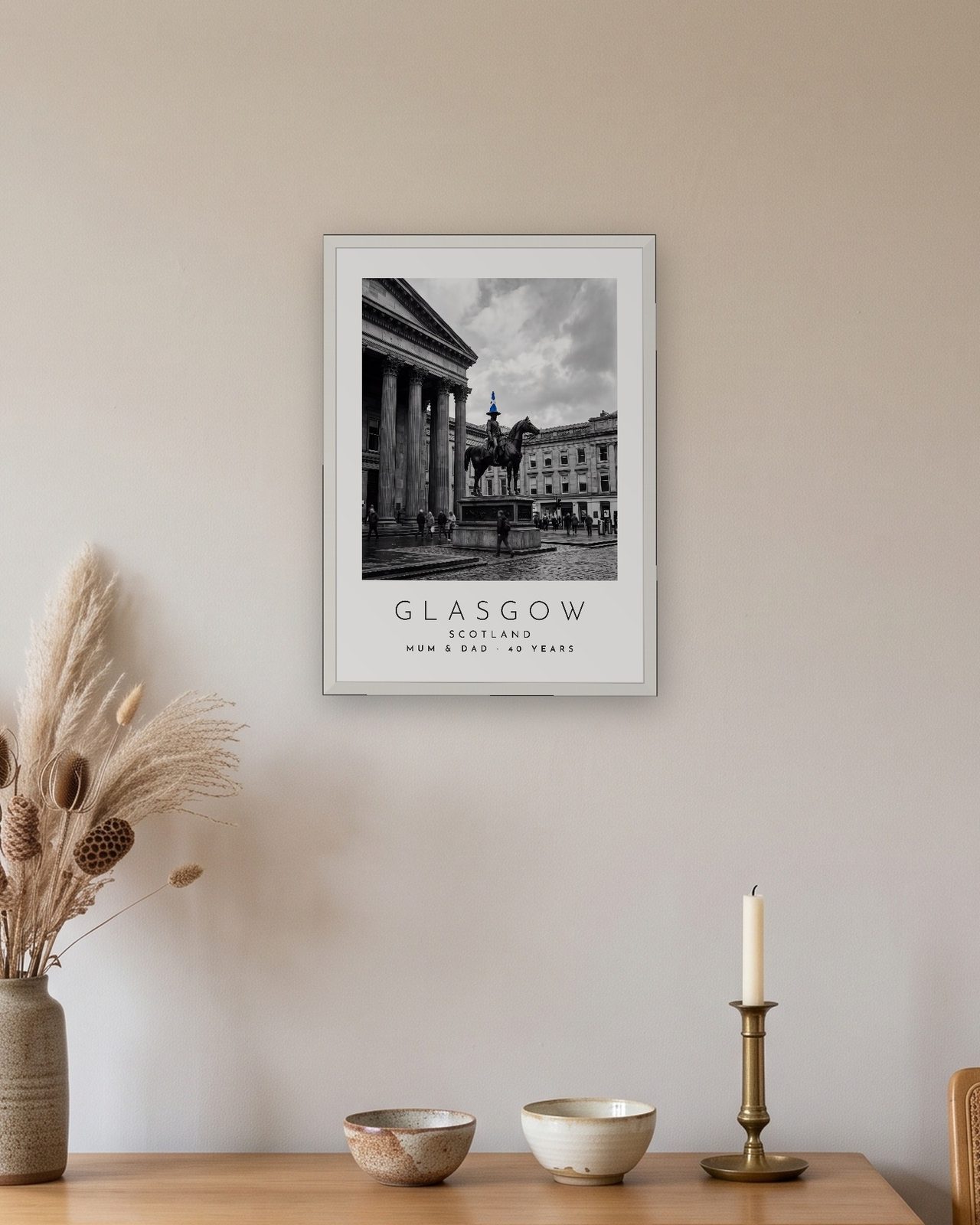Our Trip Glasgow print: white frame A3 above an oak sideboard, personalised MUM & DAD · 40 YEARS