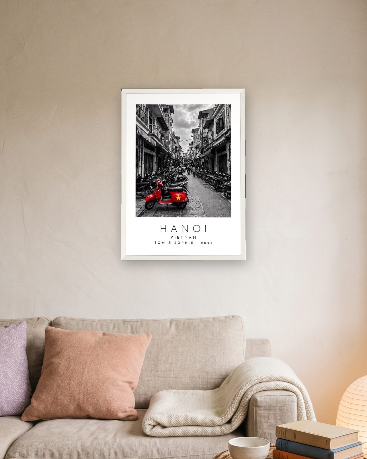 Our Trip Hanoi print: white frame A3 above a linen sofa, personalised TOM & SOPHIE · 2026