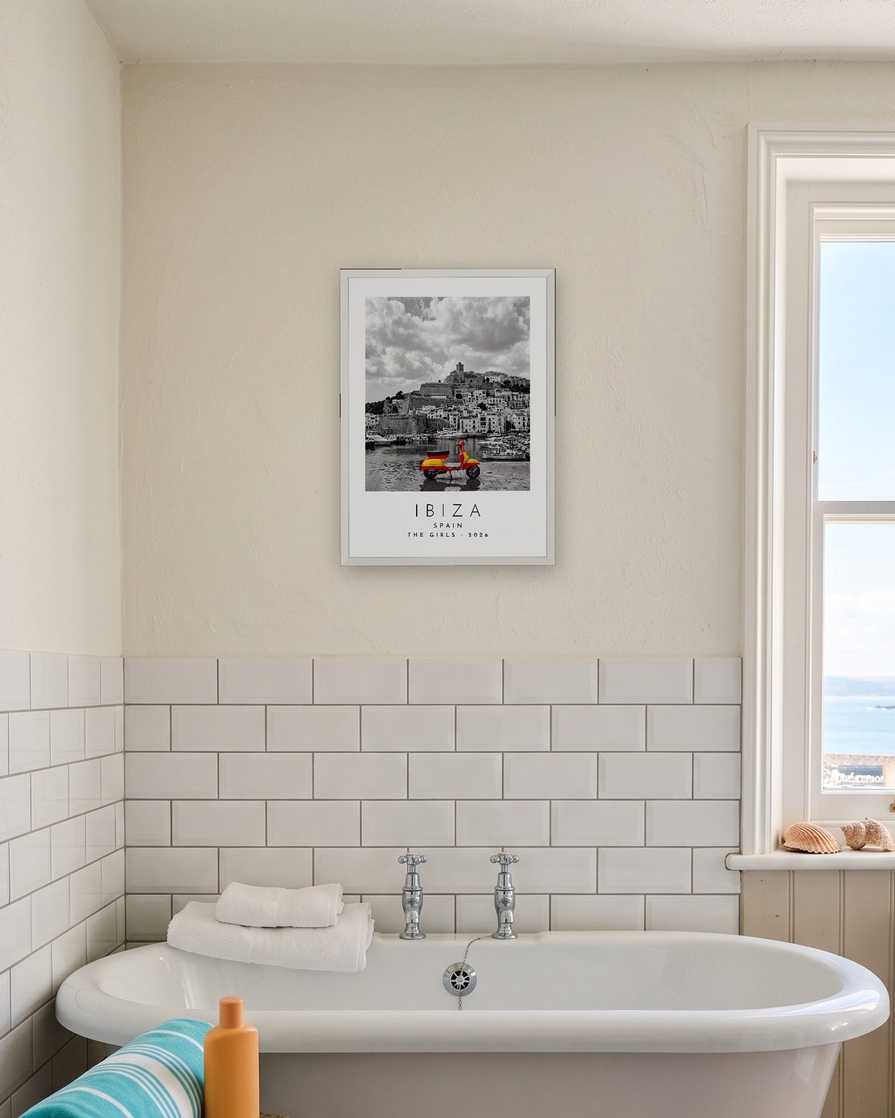 Our Trip Ibiza print: white frame A3 in a seaside bathroom, personalised THE GIRLS · 2026