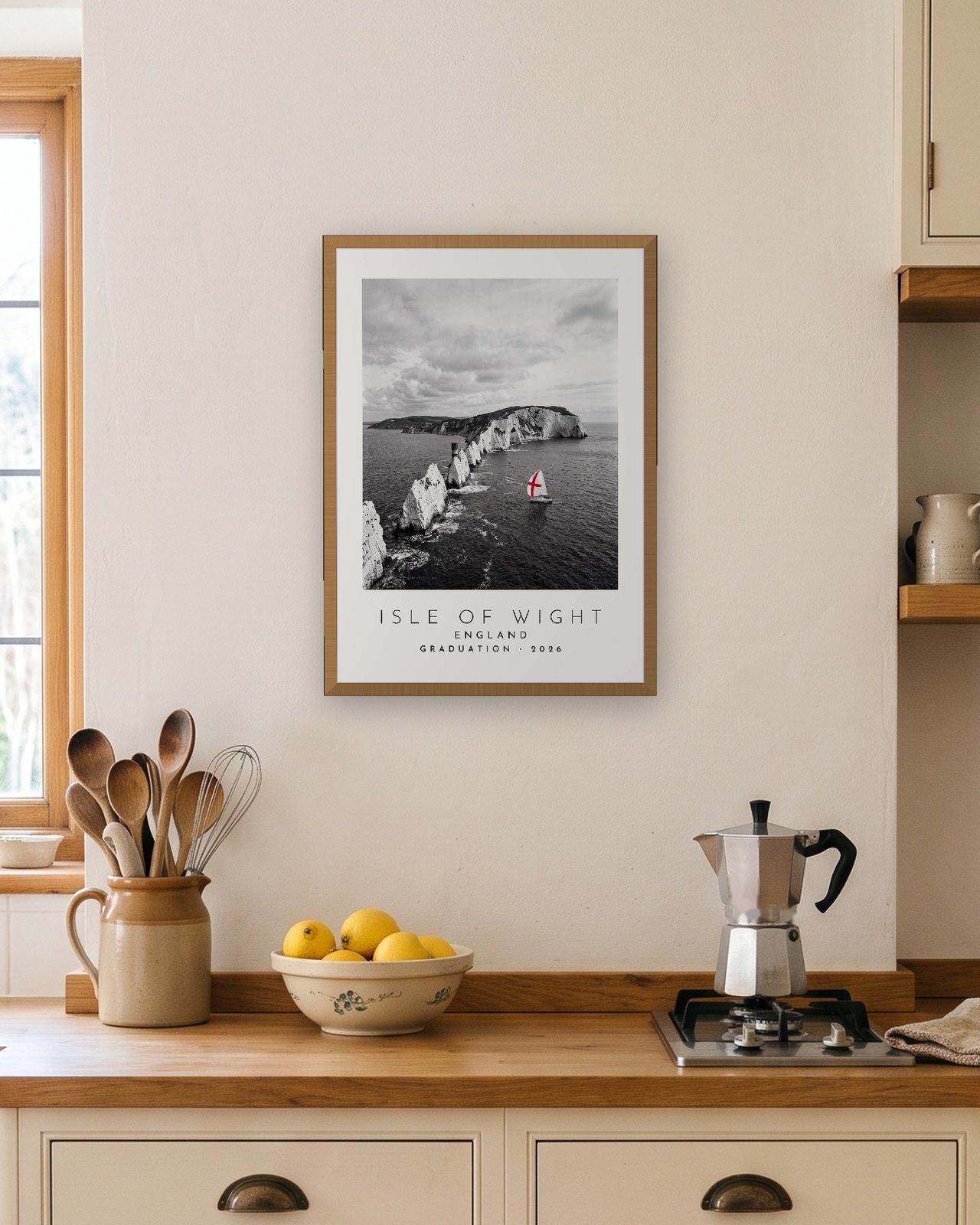 Our Trip Isle of Wight print: natural oak frame A3 in a bright kitchen, personalised GRADUATION · 2026
