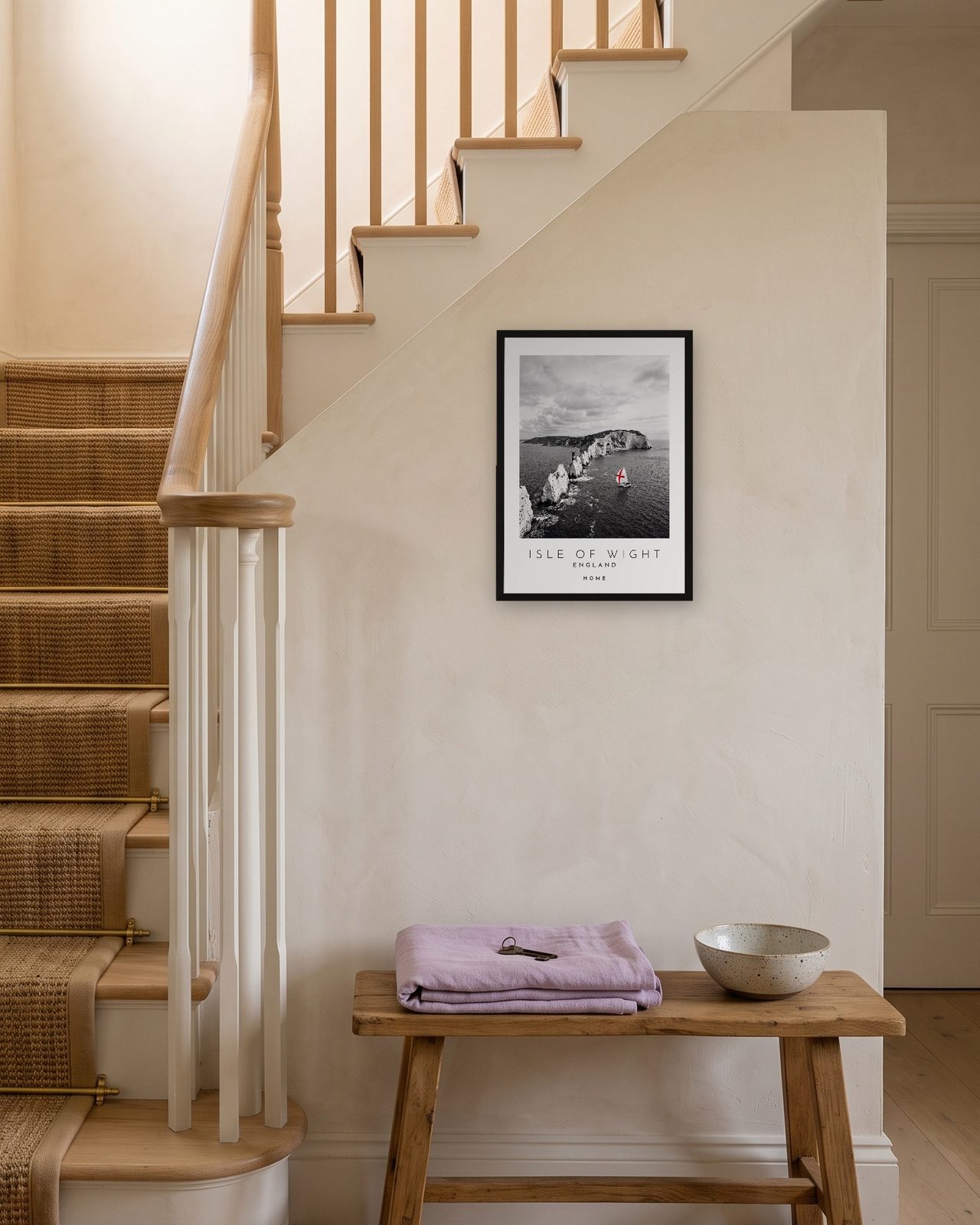 Our Trip Isle of Wight print: black frame A3 on a staircase wall, personalised HOME