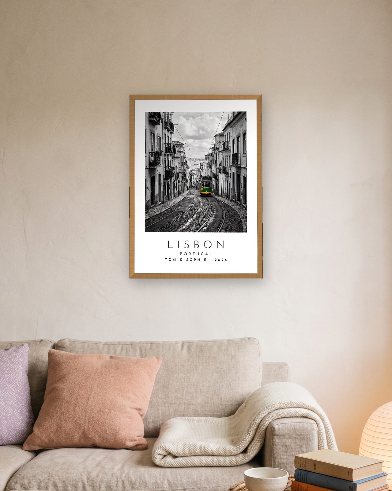 Our Trip Lisbon print: natural oak frame A3 above a linen sofa, personalised TOM & SOPHIE · 2026