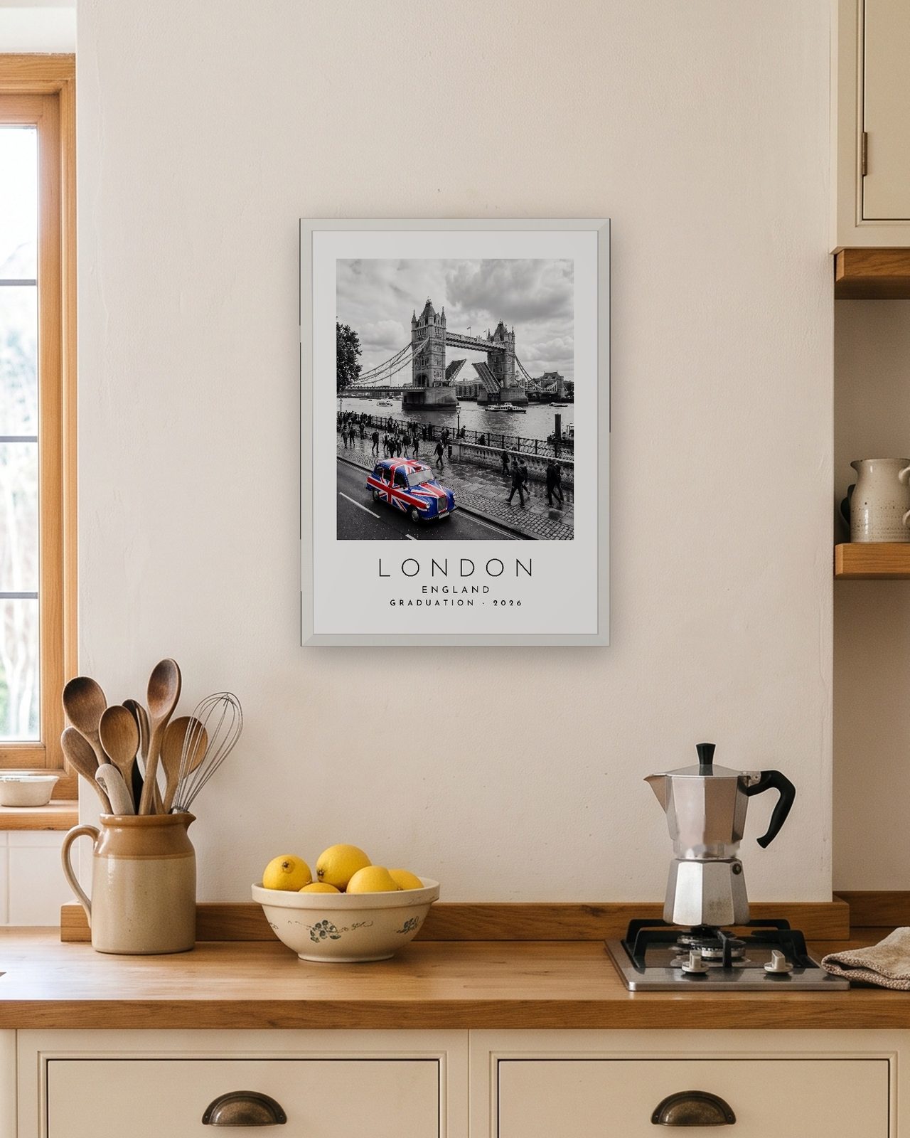 Our Trip London print: white frame A3 in a bright kitchen, personalised GRADUATION · 2026