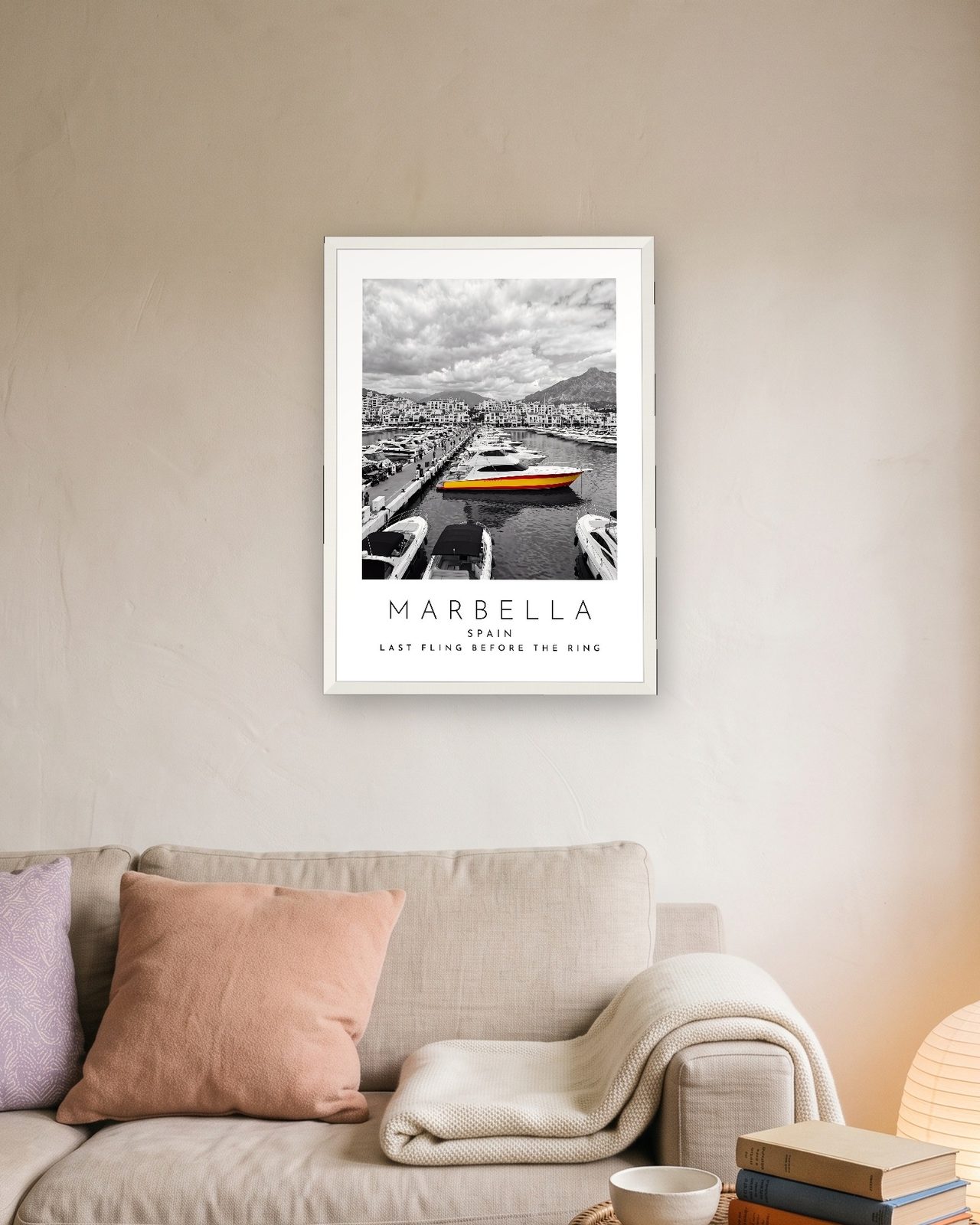 Our Trip Marbella print: white frame A3 above a linen sofa, personalised LAST FLING BEFORE THE RING