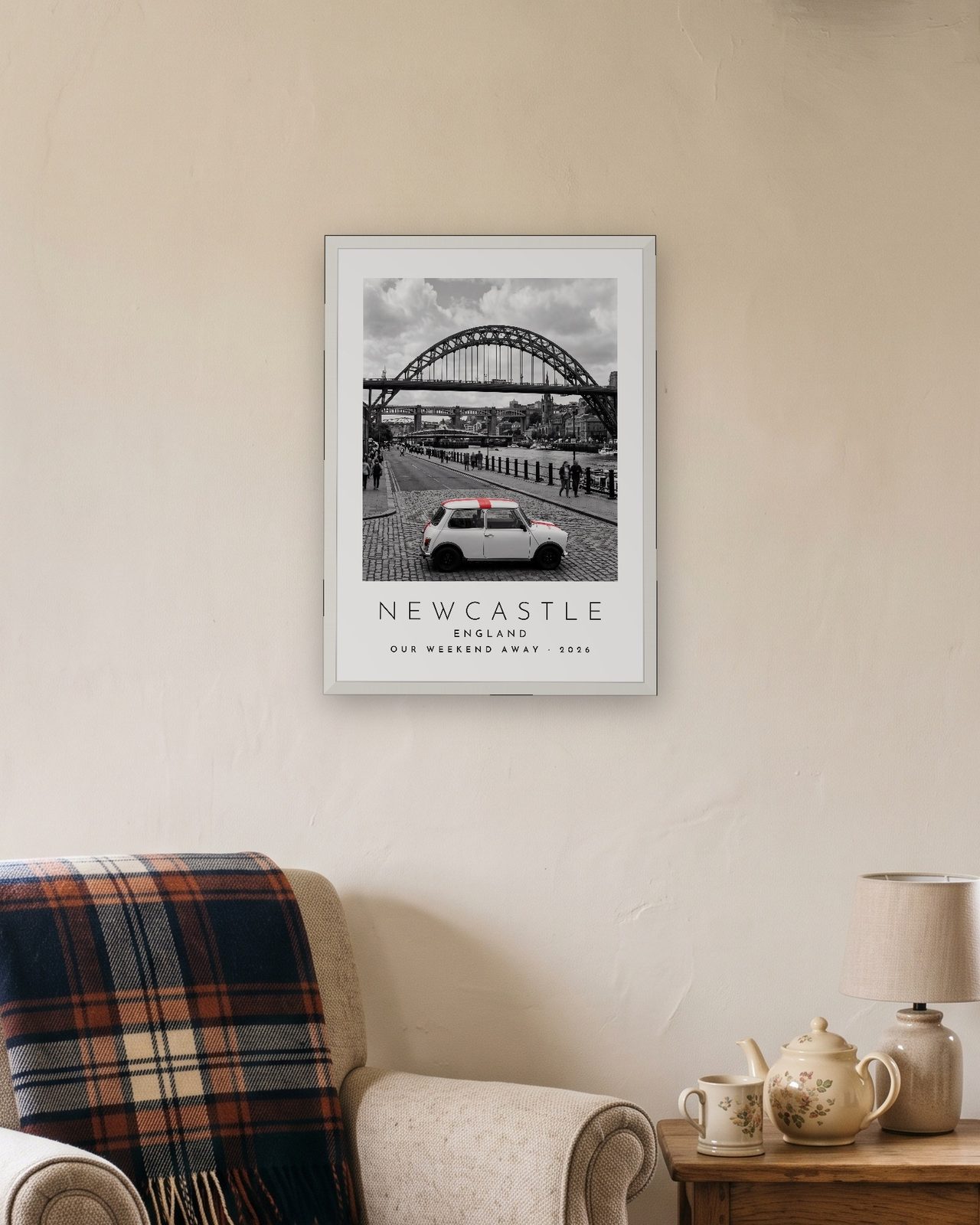 Our Trip Newcastle print: white frame A3 in a cottage snug, personalised OUR WEEKEND AWAY · 2026