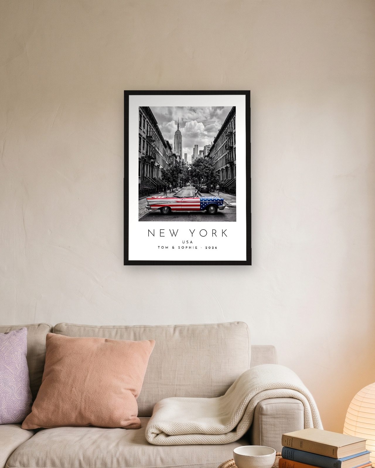 Our Trip New York print: black frame A3 above a linen sofa, personalised TOM & SOPHIE · 2026