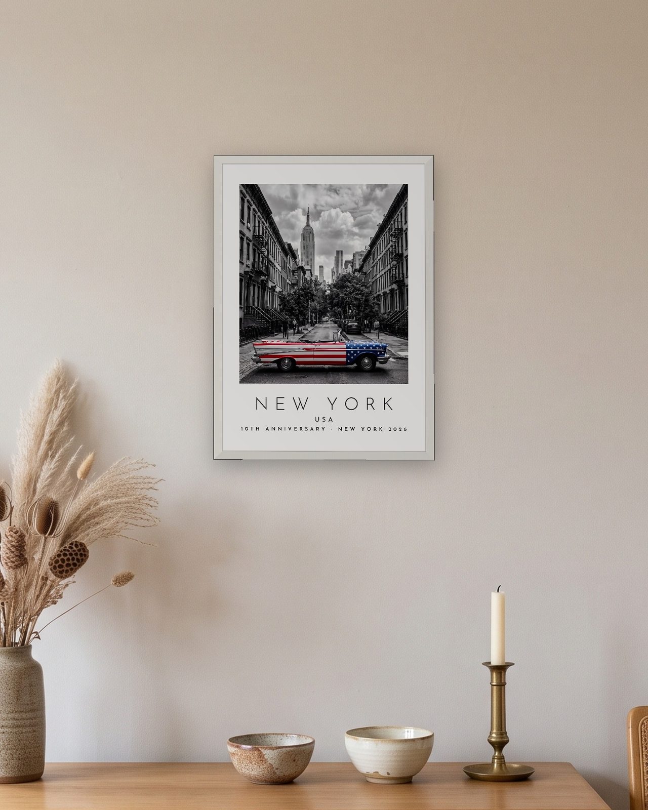 Our Trip New York print: white frame A3 above an oak sideboard, personalised 10TH ANNIVERSARY · NEW YORK 2026