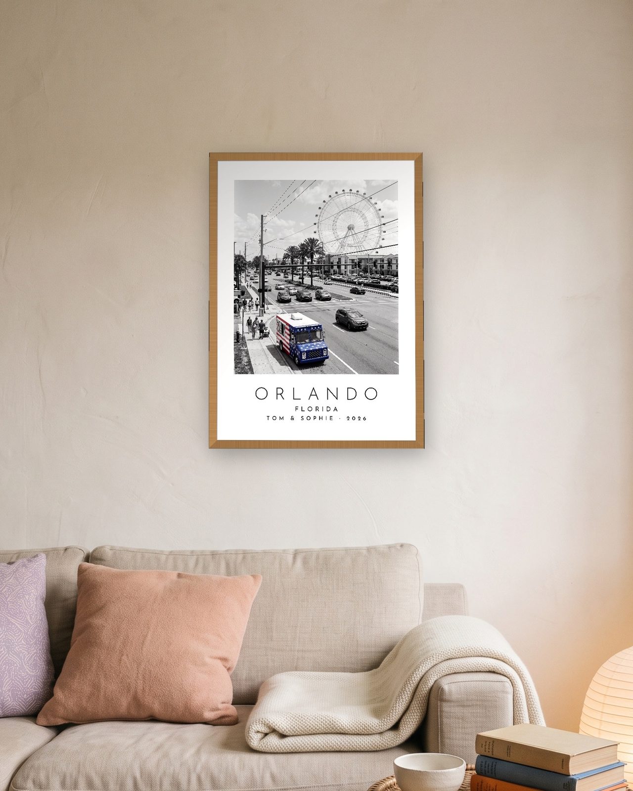 Our Trip Orlando print: natural oak frame A3 above a linen sofa, personalised TOM & SOPHIE · 2026