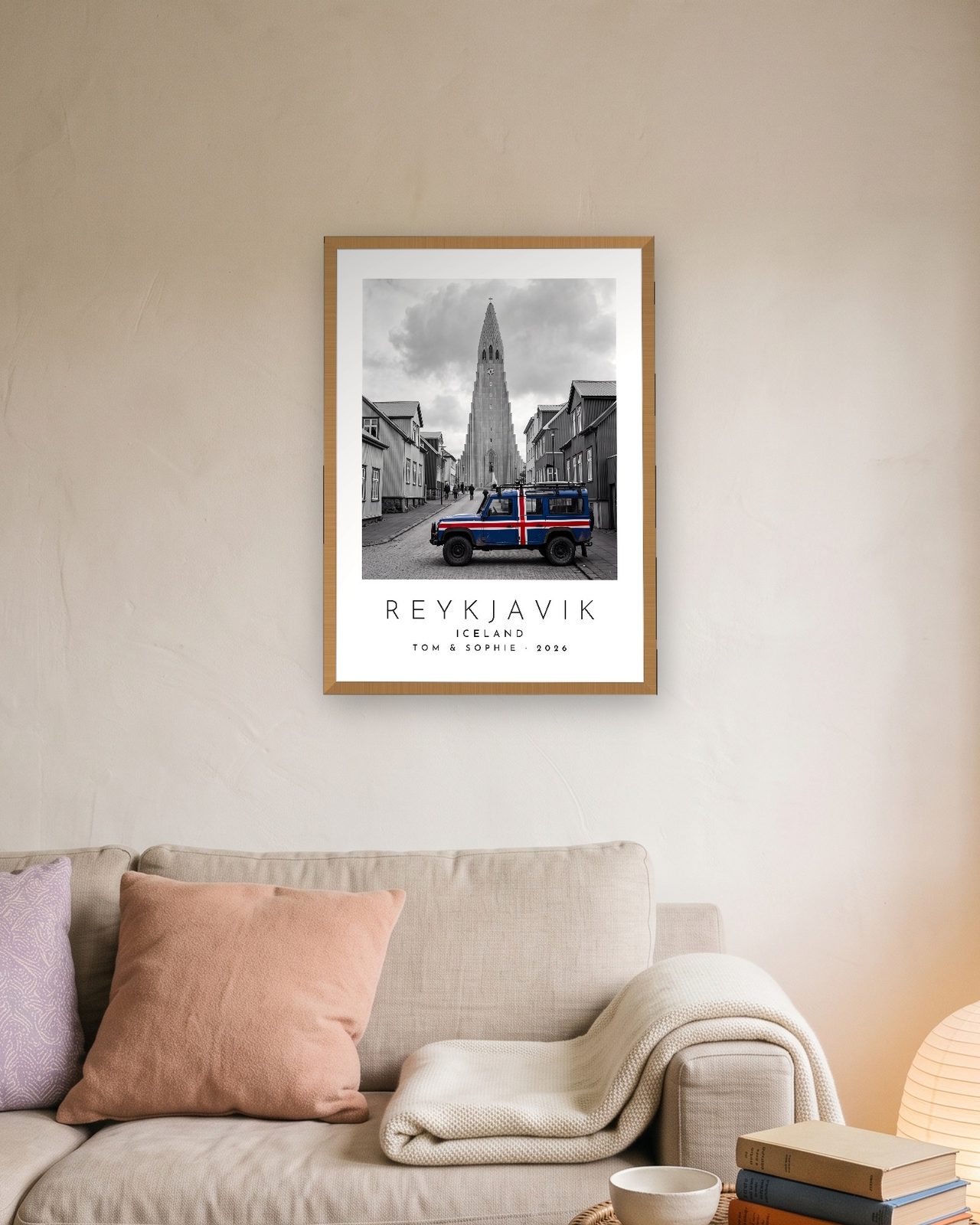 Our Trip Reykjavik print: natural oak frame A3 above a linen sofa, personalised TOM & SOPHIE · 2026