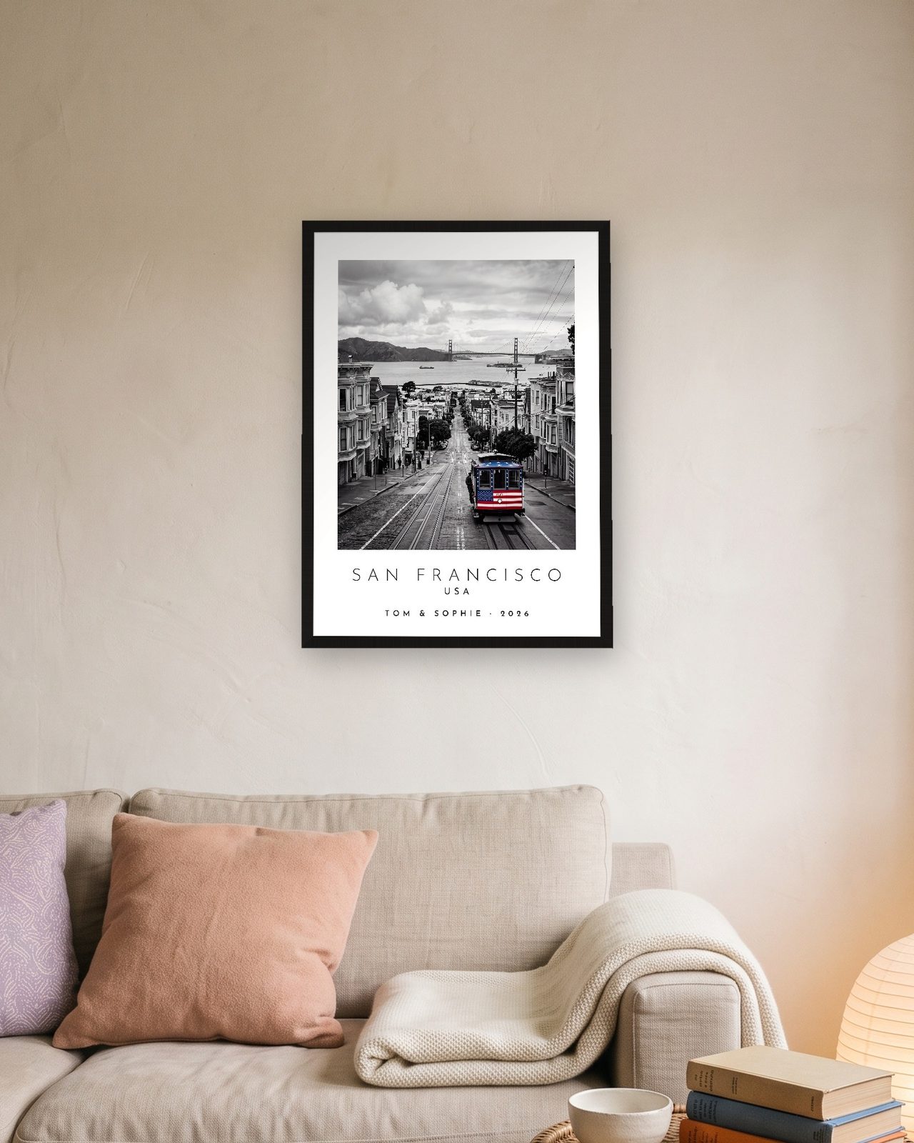 Our Trip San Francisco print: black frame A3 above a linen sofa, personalised TOM & SOPHIE · 2026