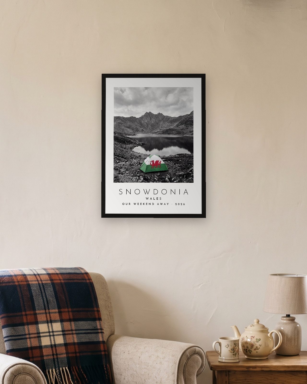Our Trip Snowdonia print: black frame A3 in a cottage snug, personalised OUR WEEKEND AWAY · 2026