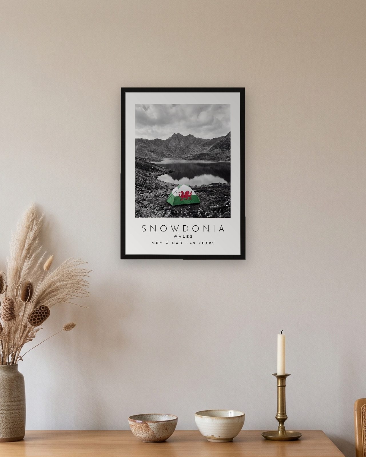 Our Trip Snowdonia print: black frame A3 above an oak sideboard, personalised MUM & DAD · 40 YEARS