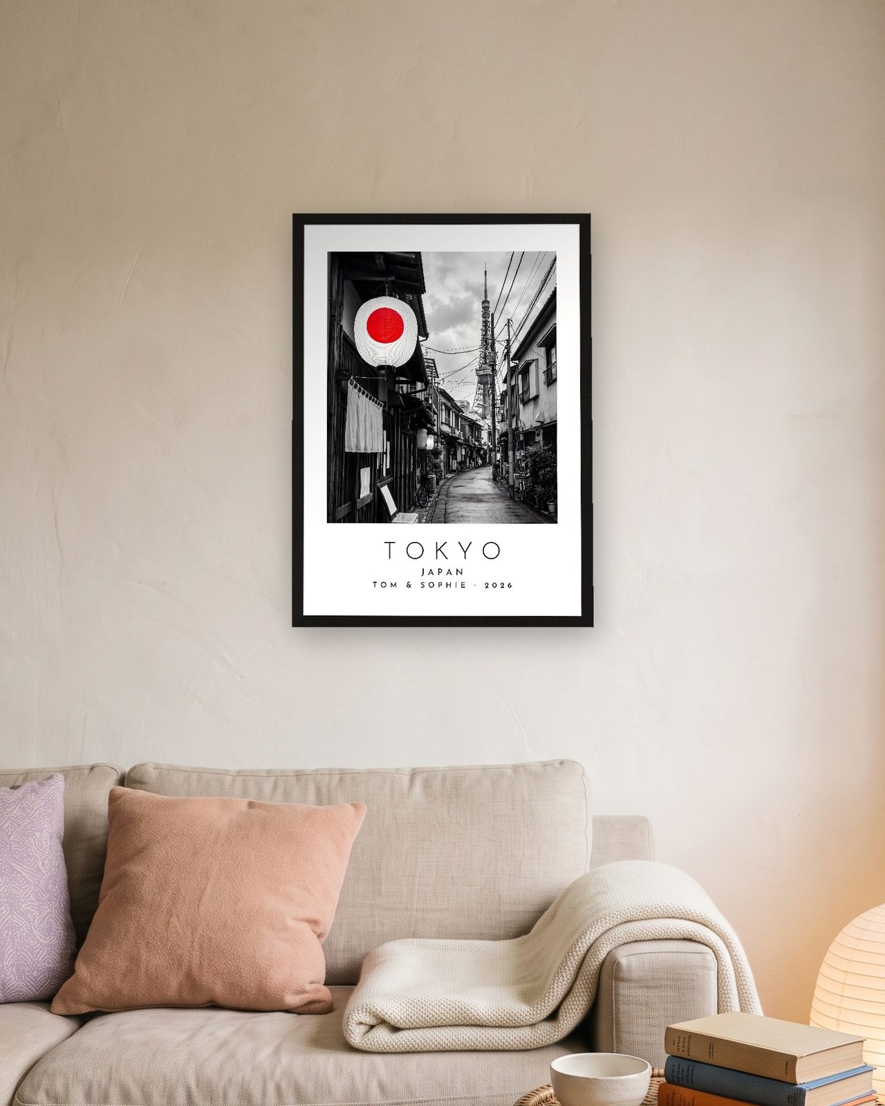 Our Trip Tokyo print: black frame A3 above a linen sofa, personalised TOM & SOPHIE · 2026