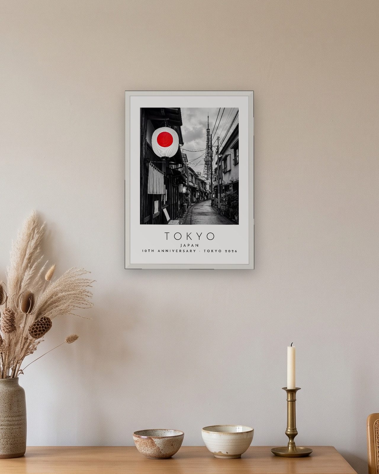 Our Trip Tokyo print: white frame A3 above an oak sideboard, personalised 10TH ANNIVERSARY · TOKYO 2026