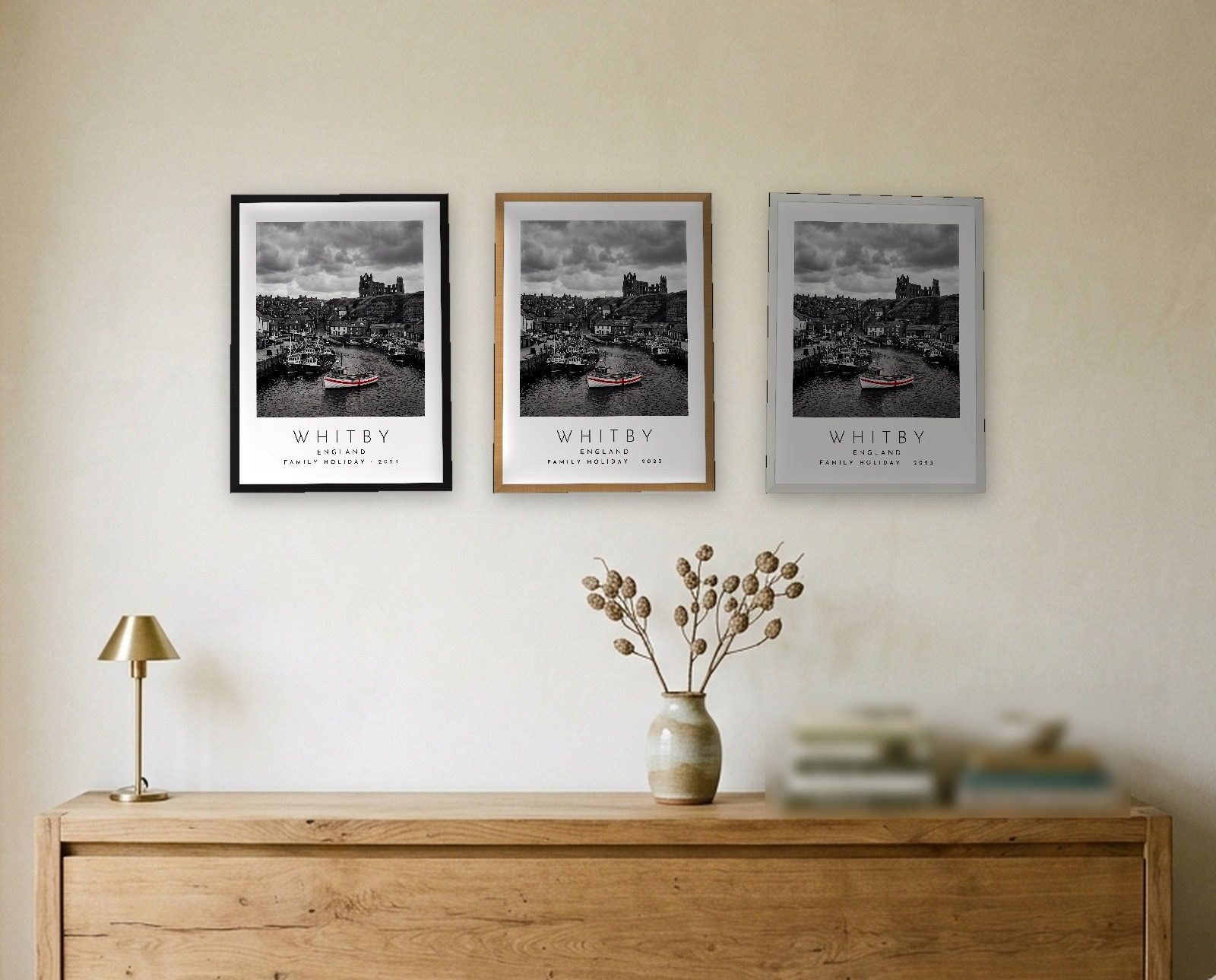 Our Trip Whitby print: the three frame finishes side by side black natural oak white