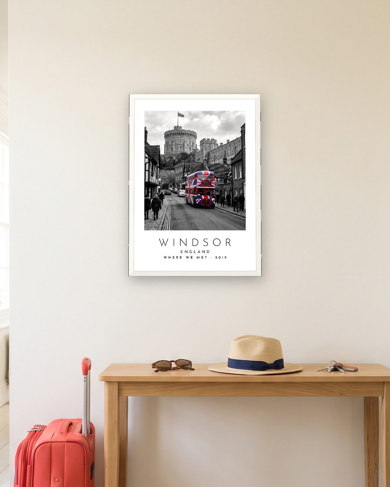 Our Trip Windsor print: white frame A3 in a hallway with a packed suitcase, personalised WHERE WE MET · 2019
